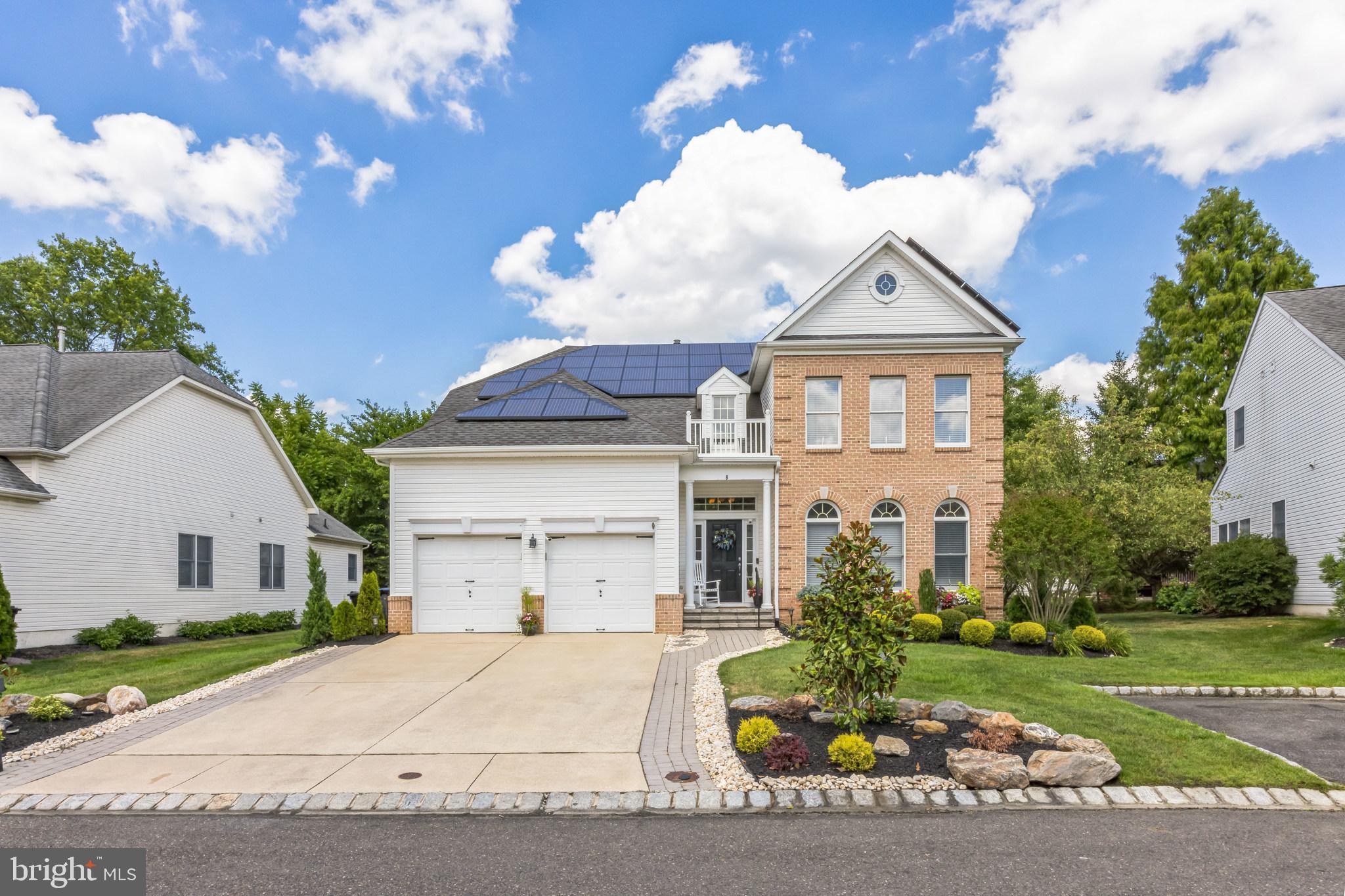 8 Kelso Lane Cinnaminson, NJ 08077 - Photo 2 of 38 a front view of a house with a garden