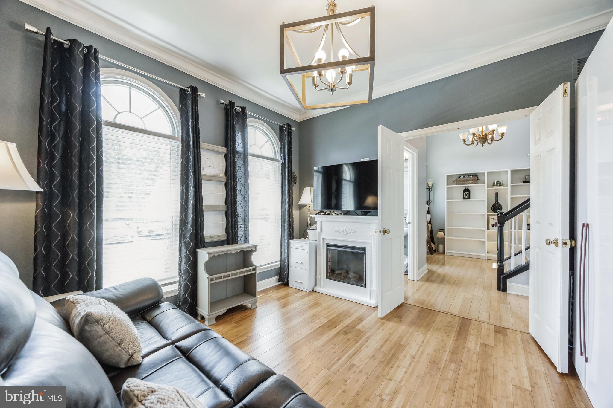 8 Kelso Lane Cinnaminson, NJ 08077 - Photo 6 of 38 a living room with furniture fireplace and flat screen tv