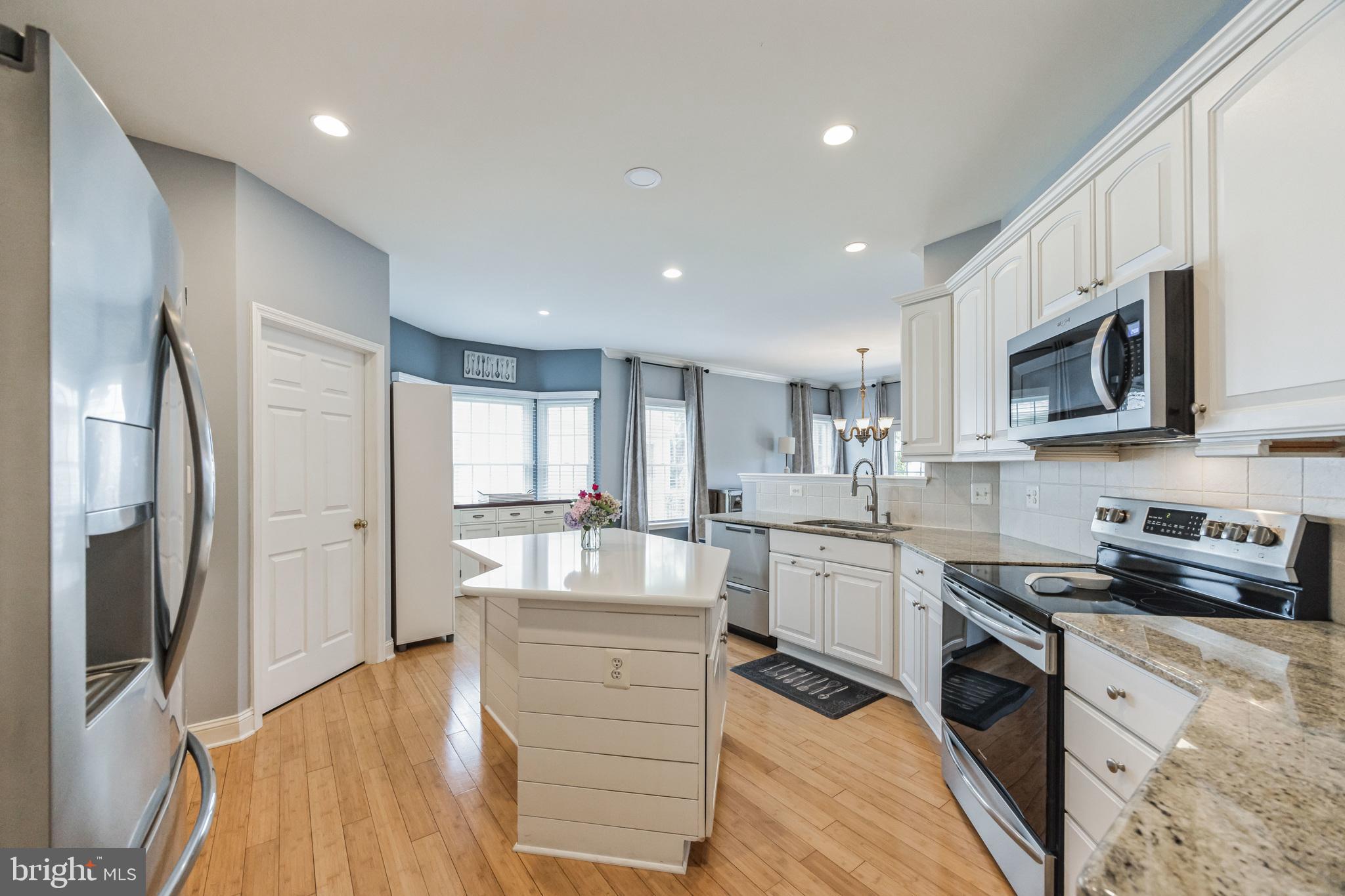 8 Kelso Lane Cinnaminson, NJ 08077 - Photo 10 of 38 a kitchen with stainless steel appliances granite countertop a refrigerator stove microwave and sink