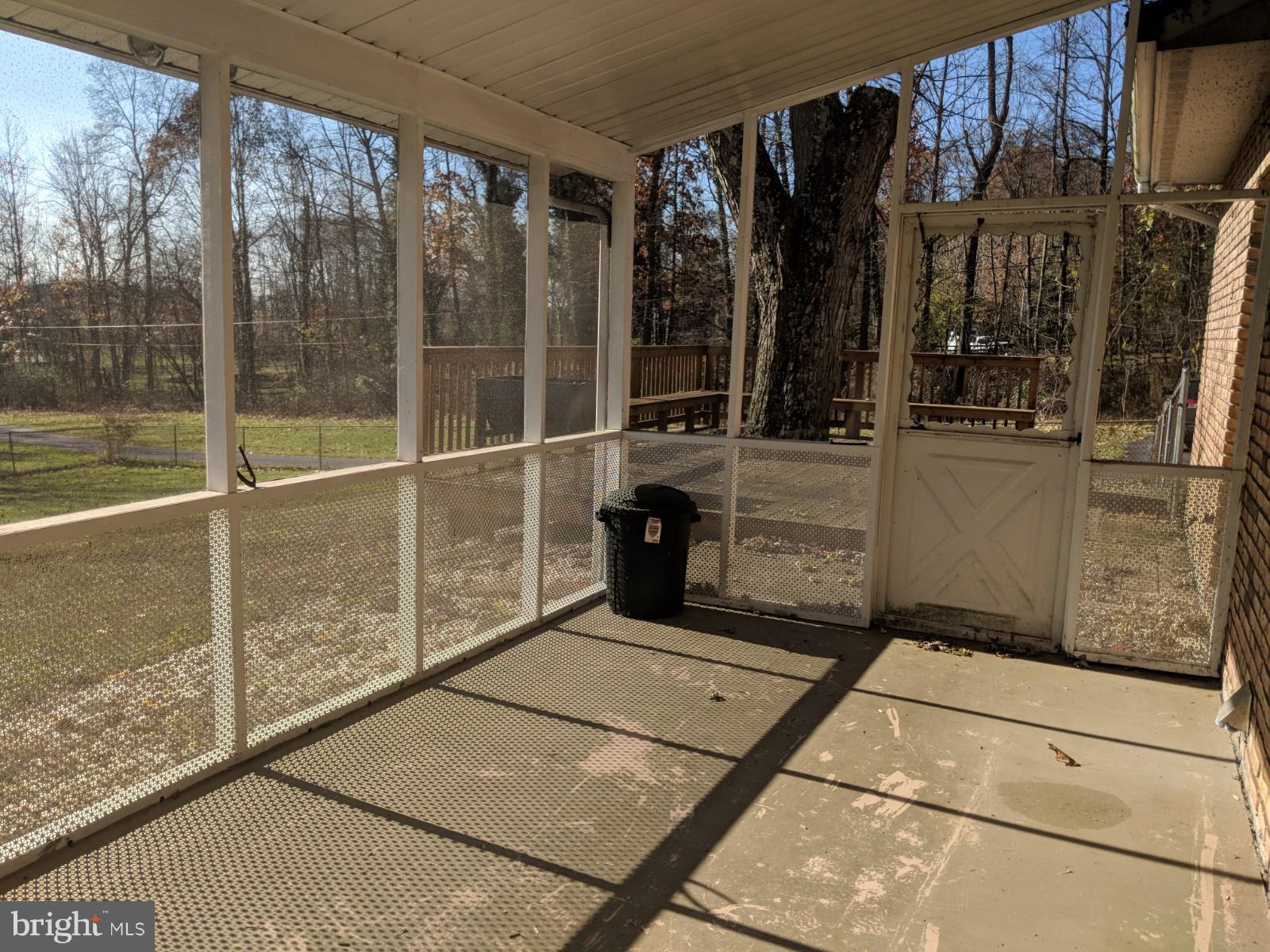 9377 Mountain Road Grantville, PA 17028 - Photo 4 of 38 Screened in porch leading to deck