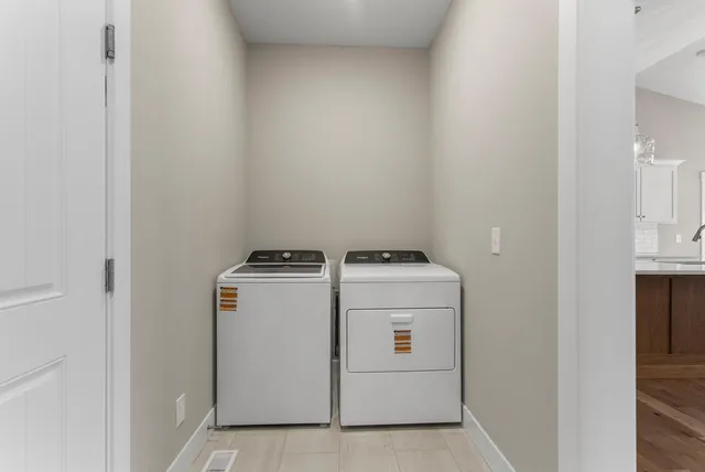 a utility room with dryer and washer