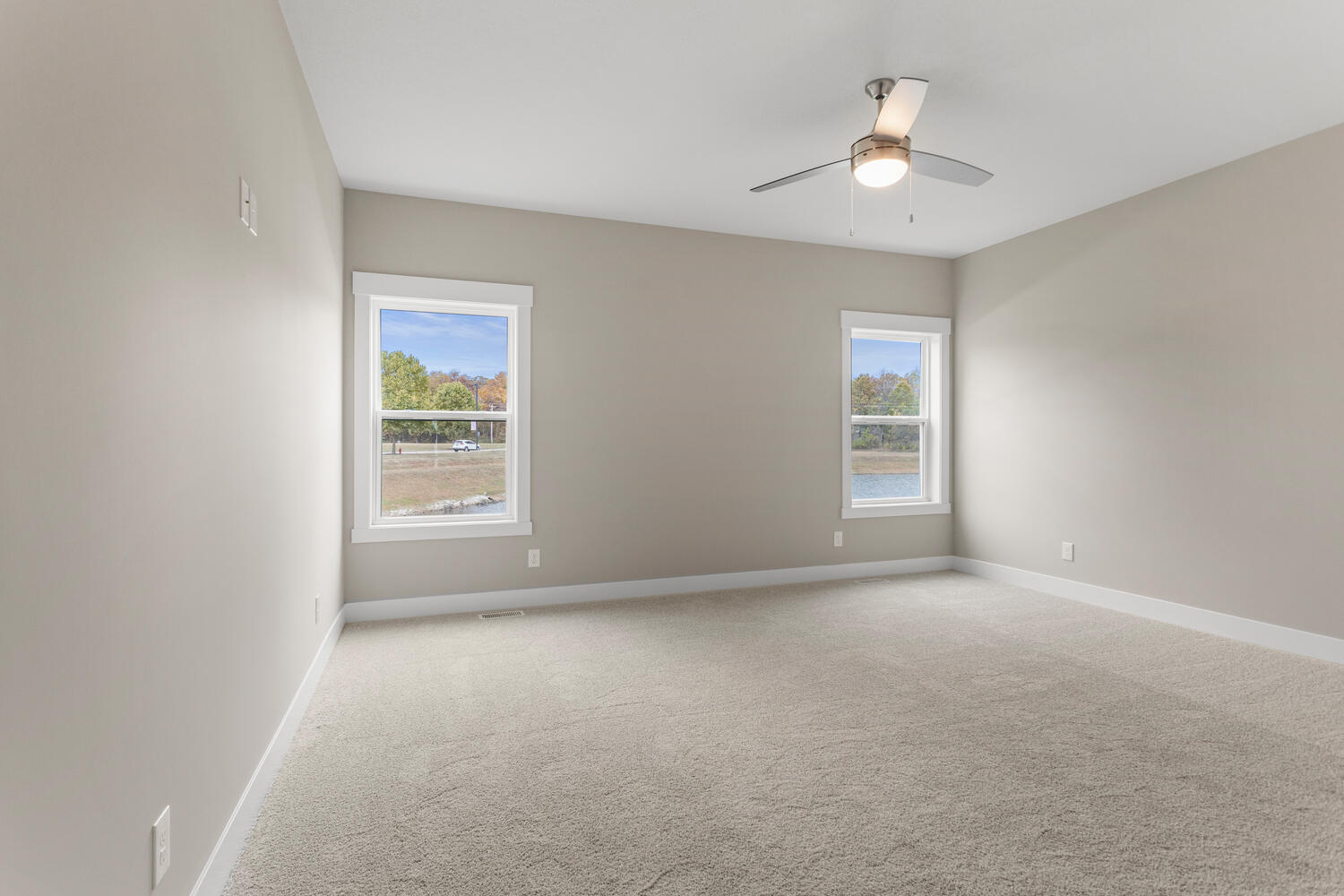4 Forest Drive Monticello, IL 61856 - Photo 13 of 34 an empty room with windows and chandelier fan
