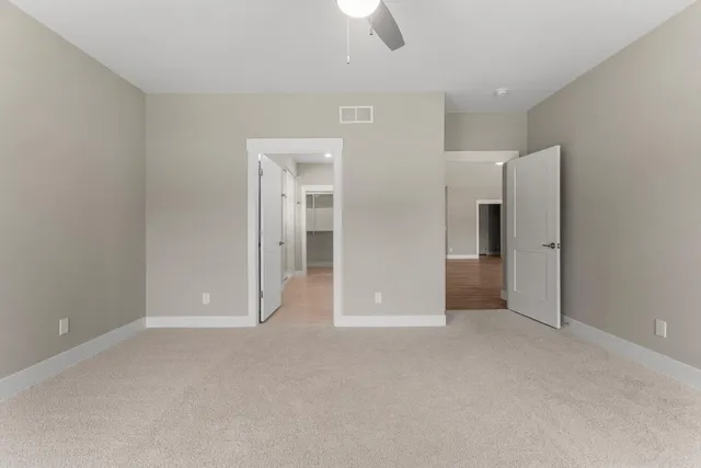 an empty room with closet area