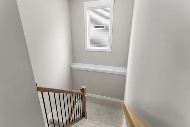 a view of a hallway with a window
