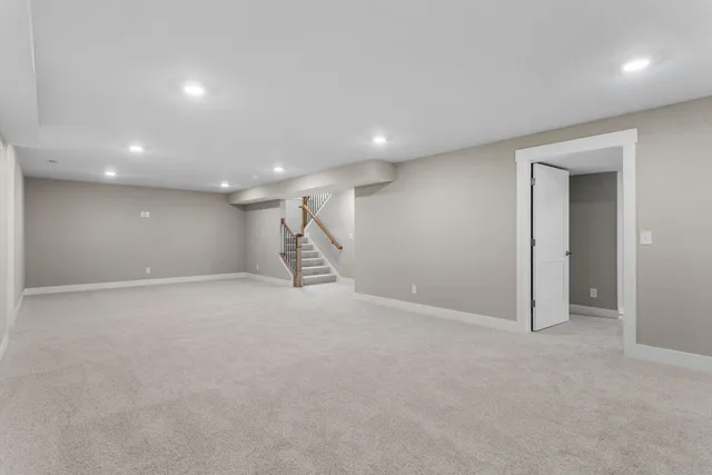 a bathroom with a sink toilet vanity and shower