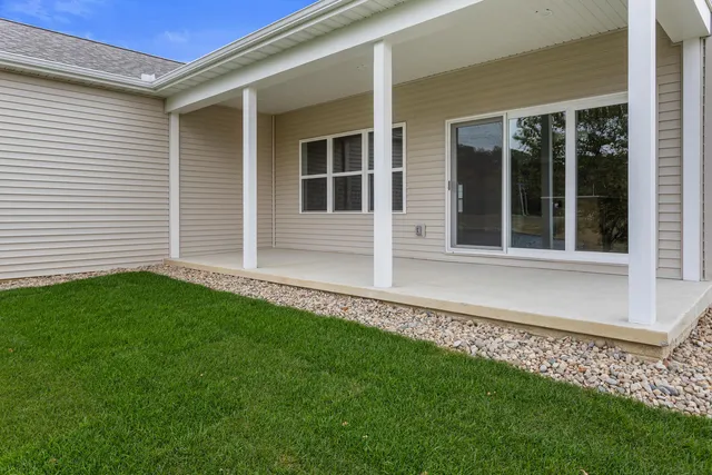 a view of lake with green field