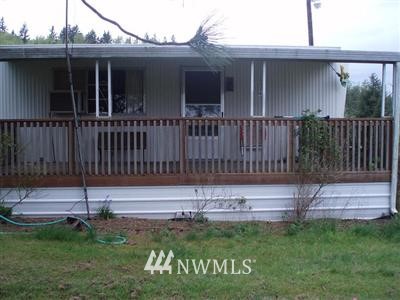 118 Salkum Road Salkum, WA 98582 - Photo 1 of 1 a view of a house with a small yard and wooden fence