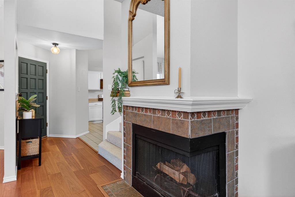 2941 Hunters Point Lane Carrollton, TX 75007 - Photo 10 of 40 a living room with furniture and a fireplace