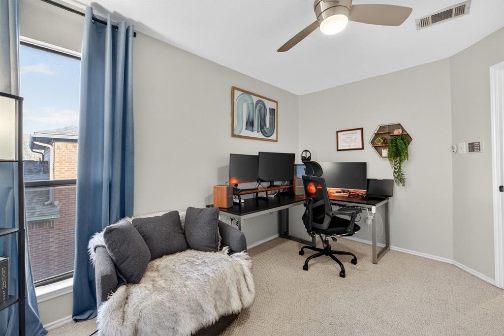 2941 Hunters Point Lane Carrollton, TX 75007 - Photo 31 of 40 a view of a livingroom with workspace and a couch