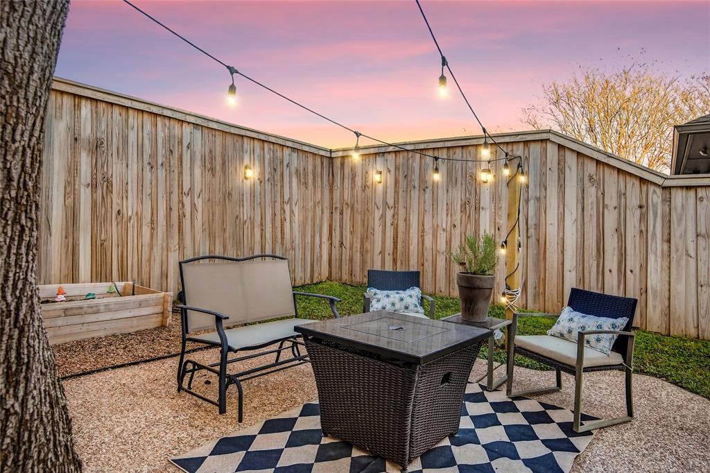 2941 Hunters Point Lane Carrollton, TX 75007 - Photo 37 of 40 a backyard of a house with table and chairs