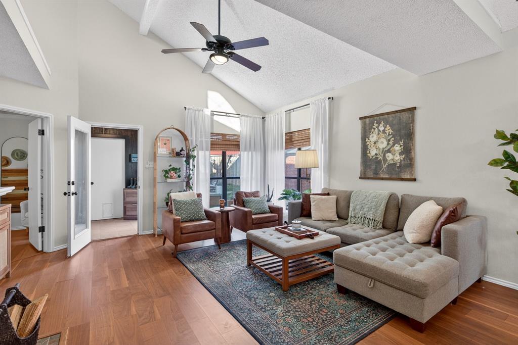 2941 Hunters Point Lane Carrollton, TX 75007 - Photo 7 of 40 a living room with furniture ceiling fan and a rug