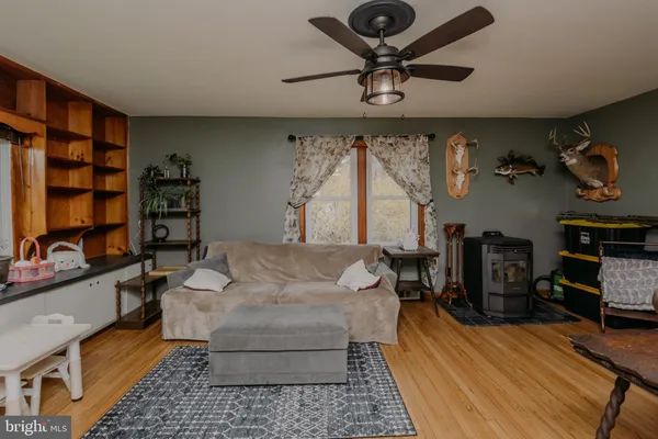 a bedroom with furniture and flat screen tv