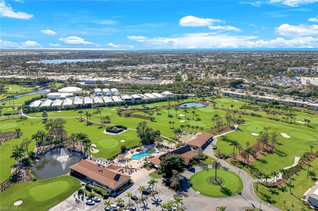 Drone / aerial view of a local golf course and a large body of water