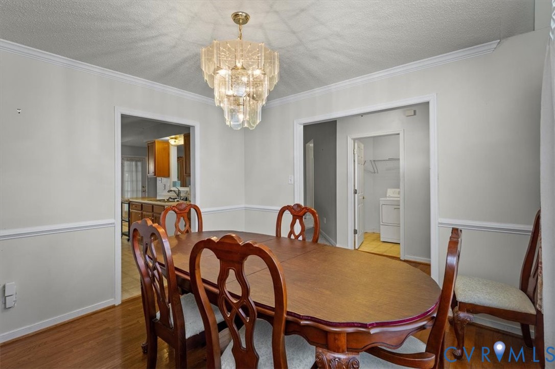 4319 Stately Oak Road North Chesterfield, VA 23234 - Photo 7 of 51 Wood-finish flooring with crown molding and chair
