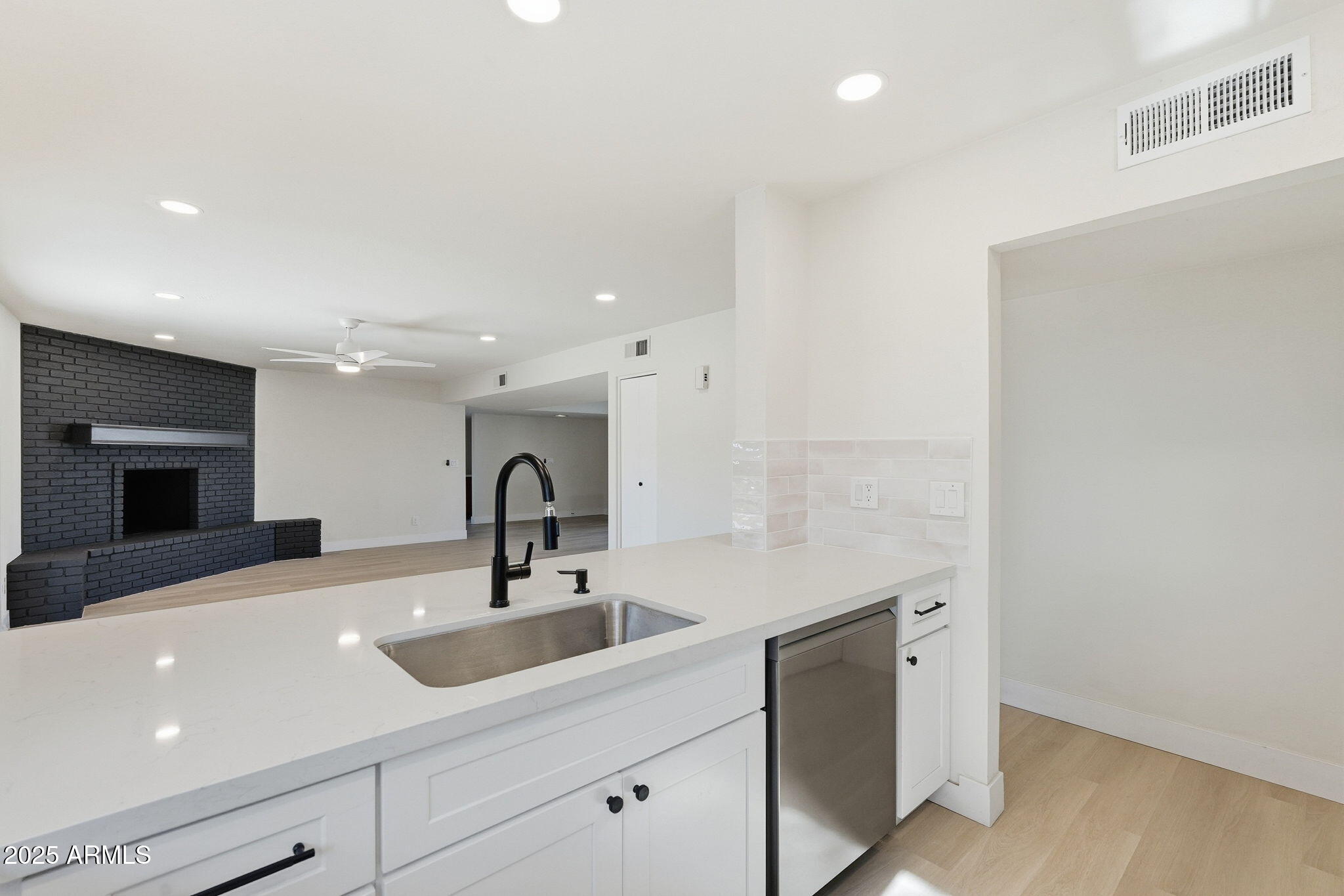 5839 West Hearn Road Glendale, AZ 85306 - Photo 11 of 35 a kitchen with a sink and a refrigerator