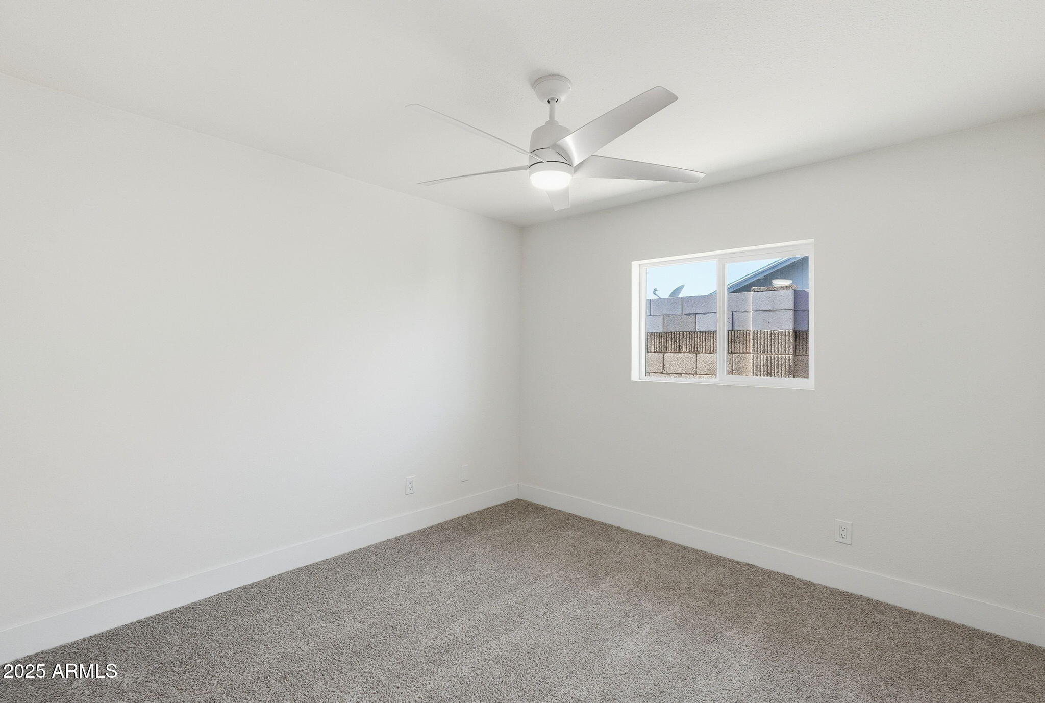 5839 West Hearn Road Glendale, AZ 85306 - Photo 19 of 35 an empty room with a window