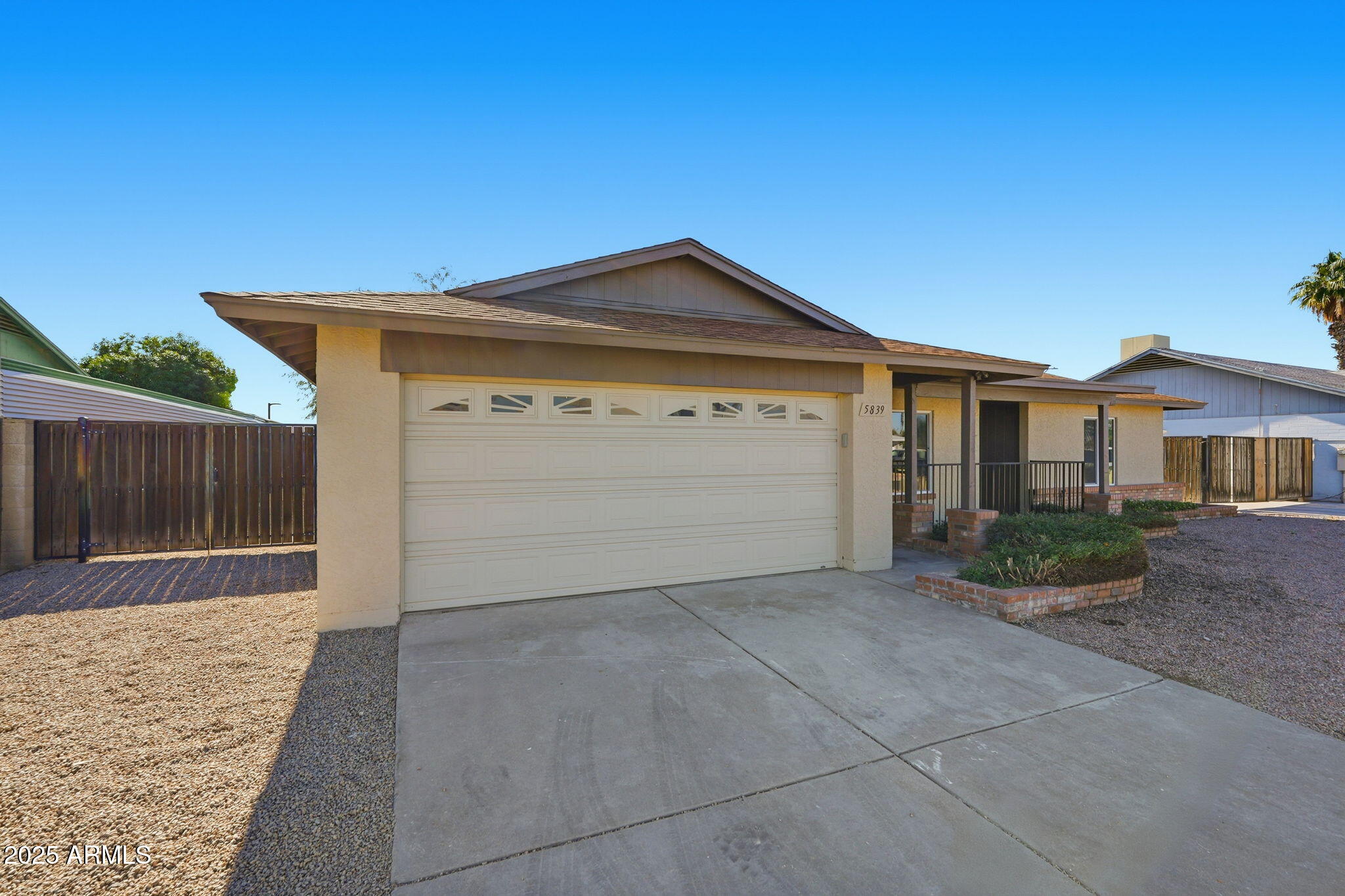 5839 West Hearn Road Glendale, AZ 85306 - Photo 2 of 35 a front view of a house with a yard