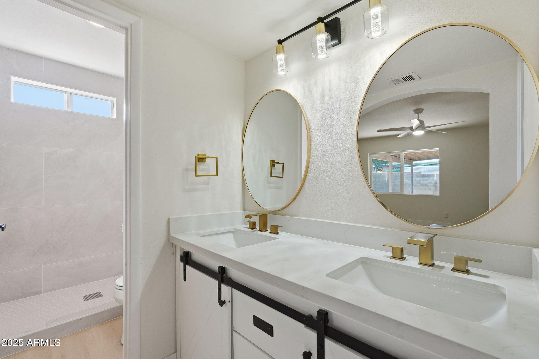 5839 West Hearn Road Glendale, AZ 85306 - Photo 25 of 35 a bathroom with a sink and a mirror