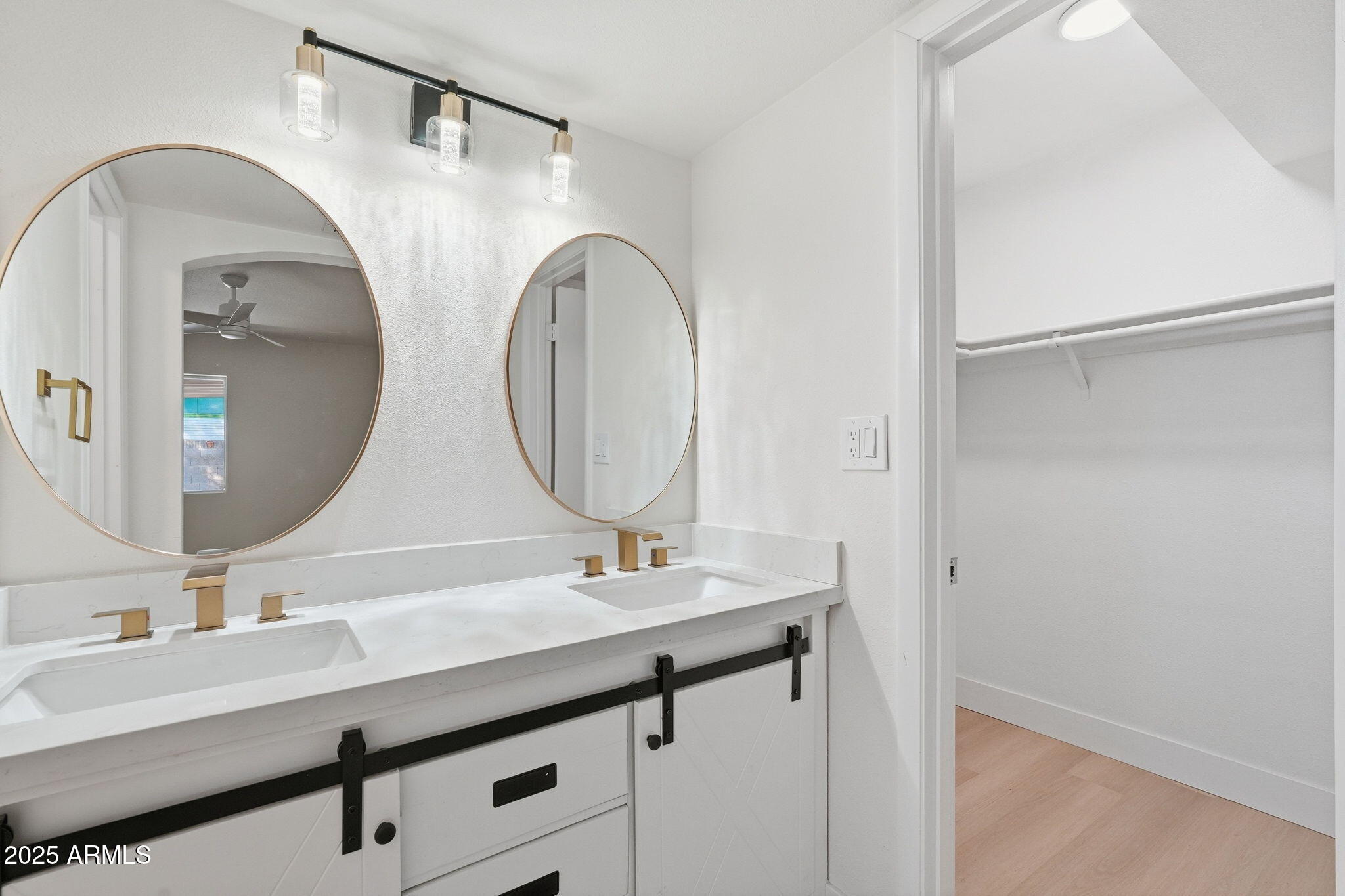 5839 West Hearn Road Glendale, AZ 85306 - Photo 28 of 35 a bathroom with a double vanity sink and a mirror
