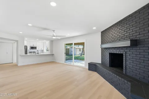 a view of an empty room with a fireplace