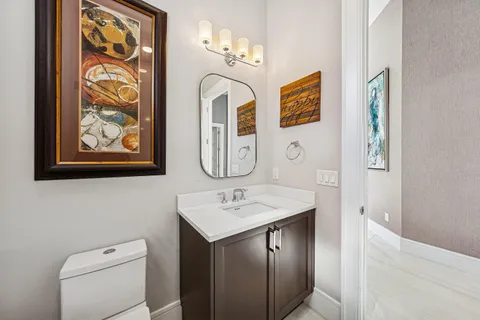 a spacious bedroom with a bed and a flat screen tv