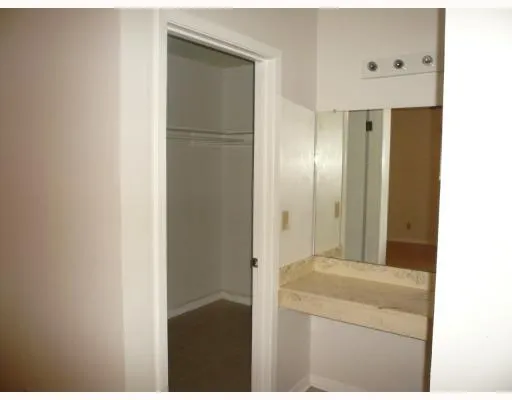 a bathroom with a double vanity sink and mirror