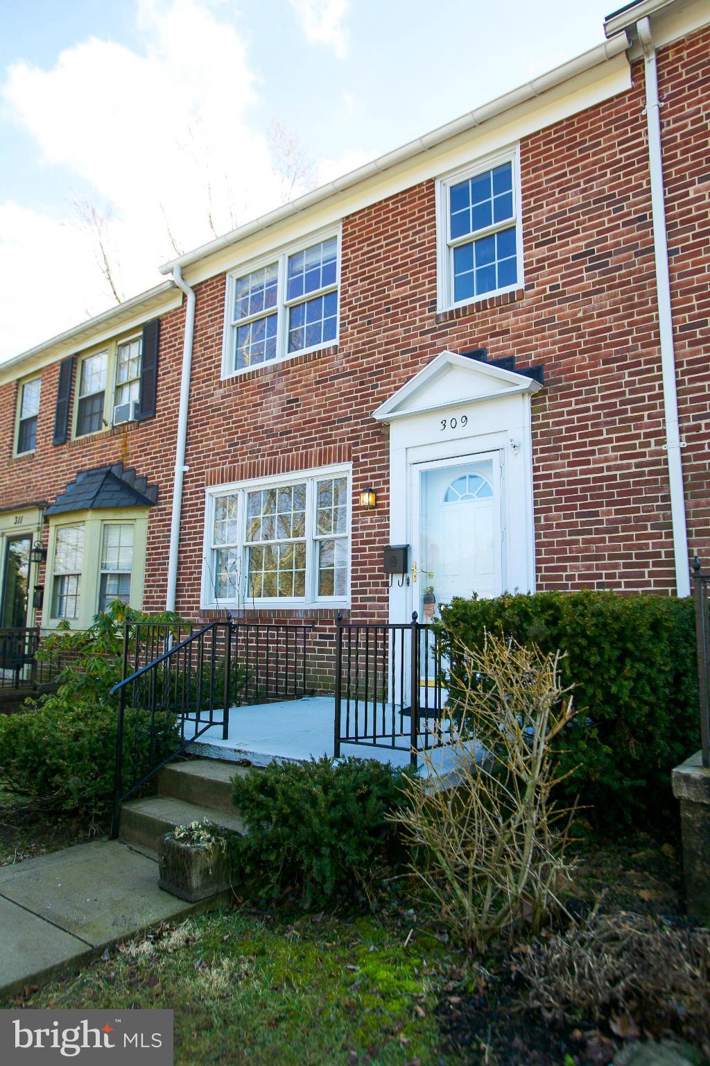 309 Overbrook Road Baltimore, MD 21212 - Photo 1 of 26 a front view of a house with garden