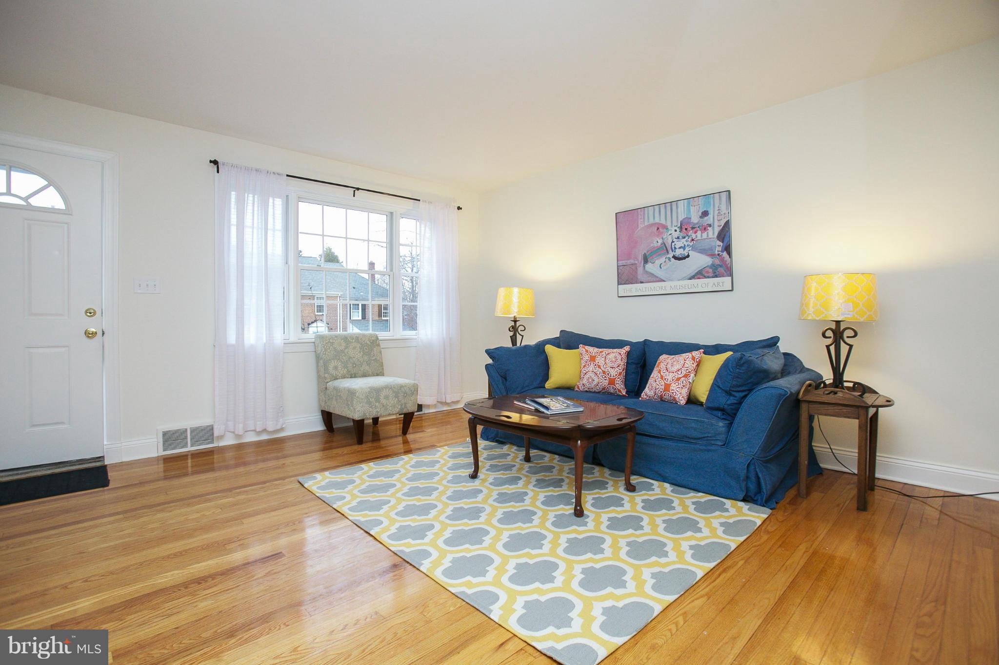 309 Overbrook Road Baltimore, MD 21212 - Photo 2 of 26 a living room with furniture and a wooden floor