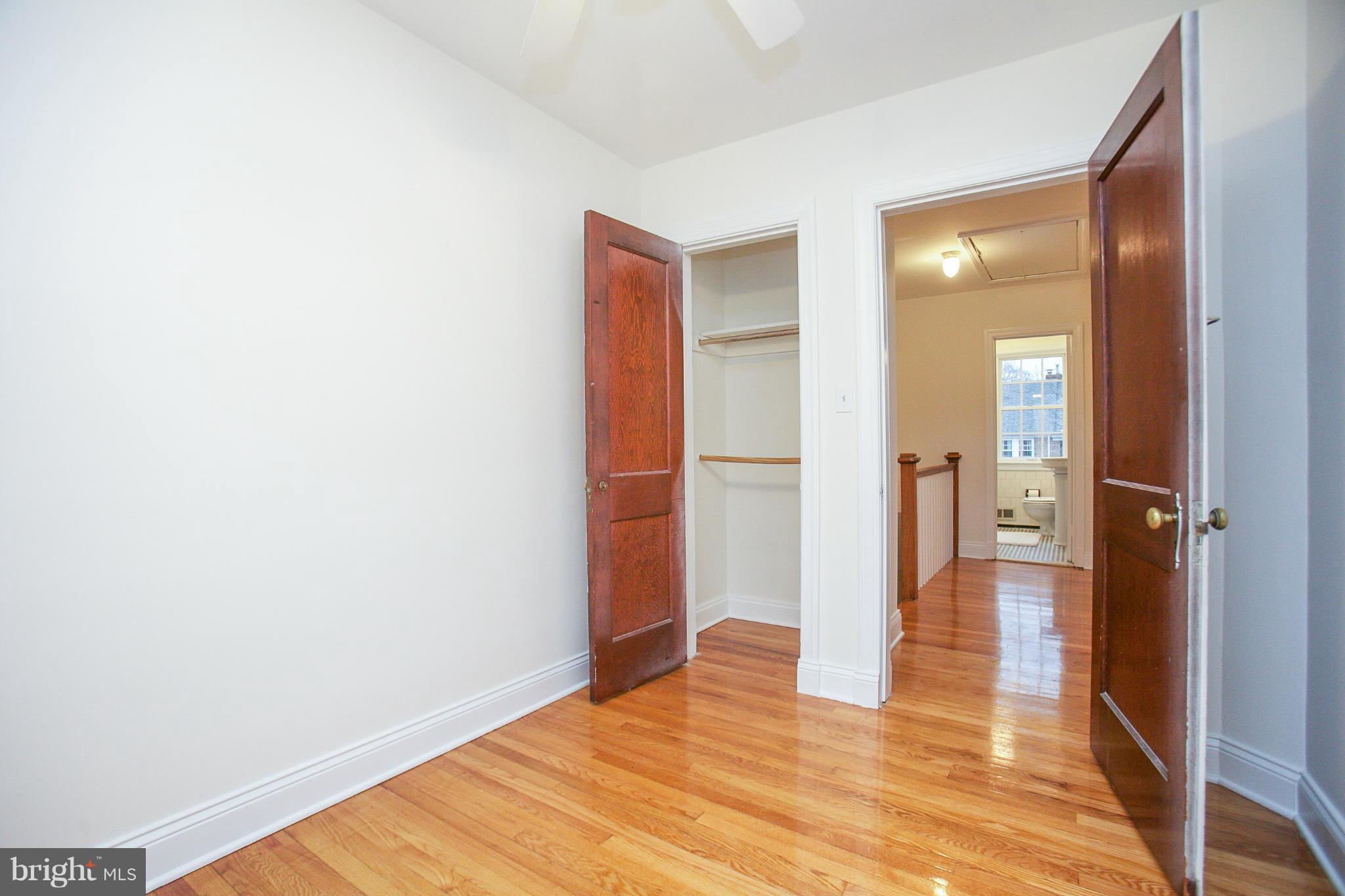309 Overbrook Road Baltimore, MD 21212 - Photo 13 of 26 a view of a room with wooden floor and a bathroom