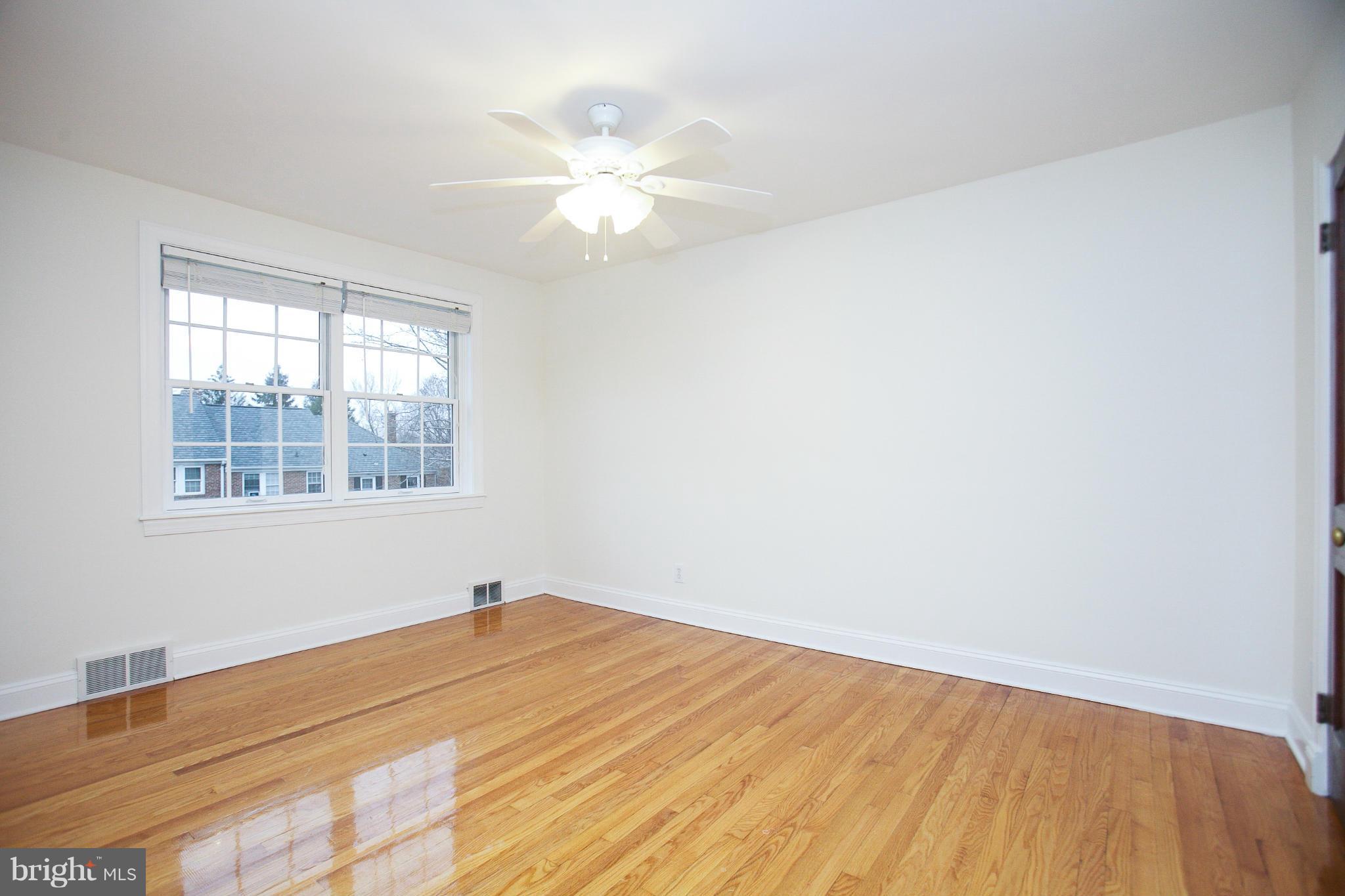 309 Overbrook Road Baltimore, MD 21212 - Photo 15 of 26 a view of a room with wooden floor and fan