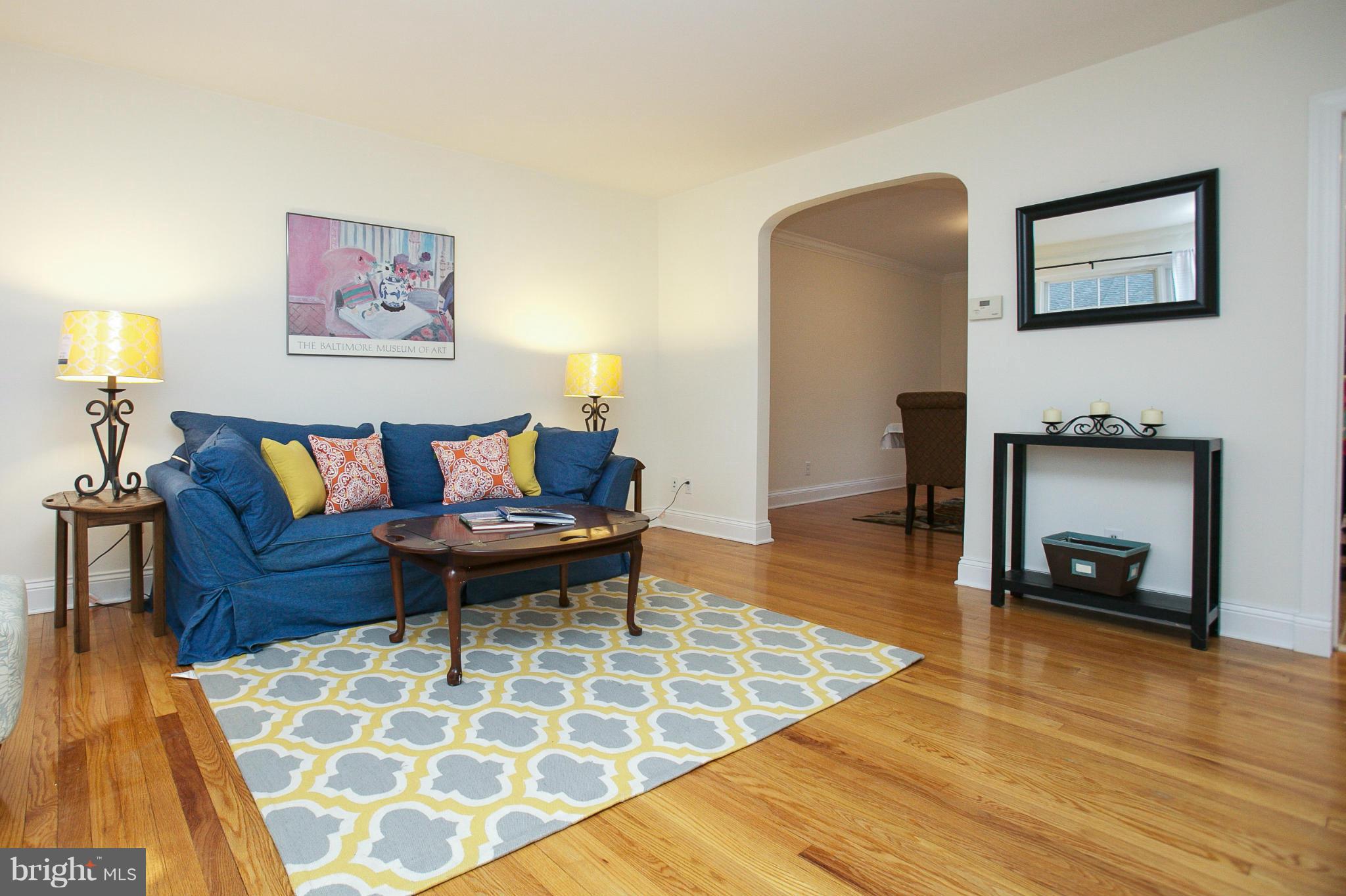 309 Overbrook Road Baltimore, MD 21212 - Photo 3 of 26 a living room with furniture and a fireplace