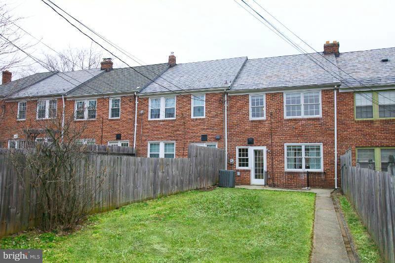 309 Overbrook Road Baltimore, MD 21212 - Photo 23 of 26 a front view of a house with a yard