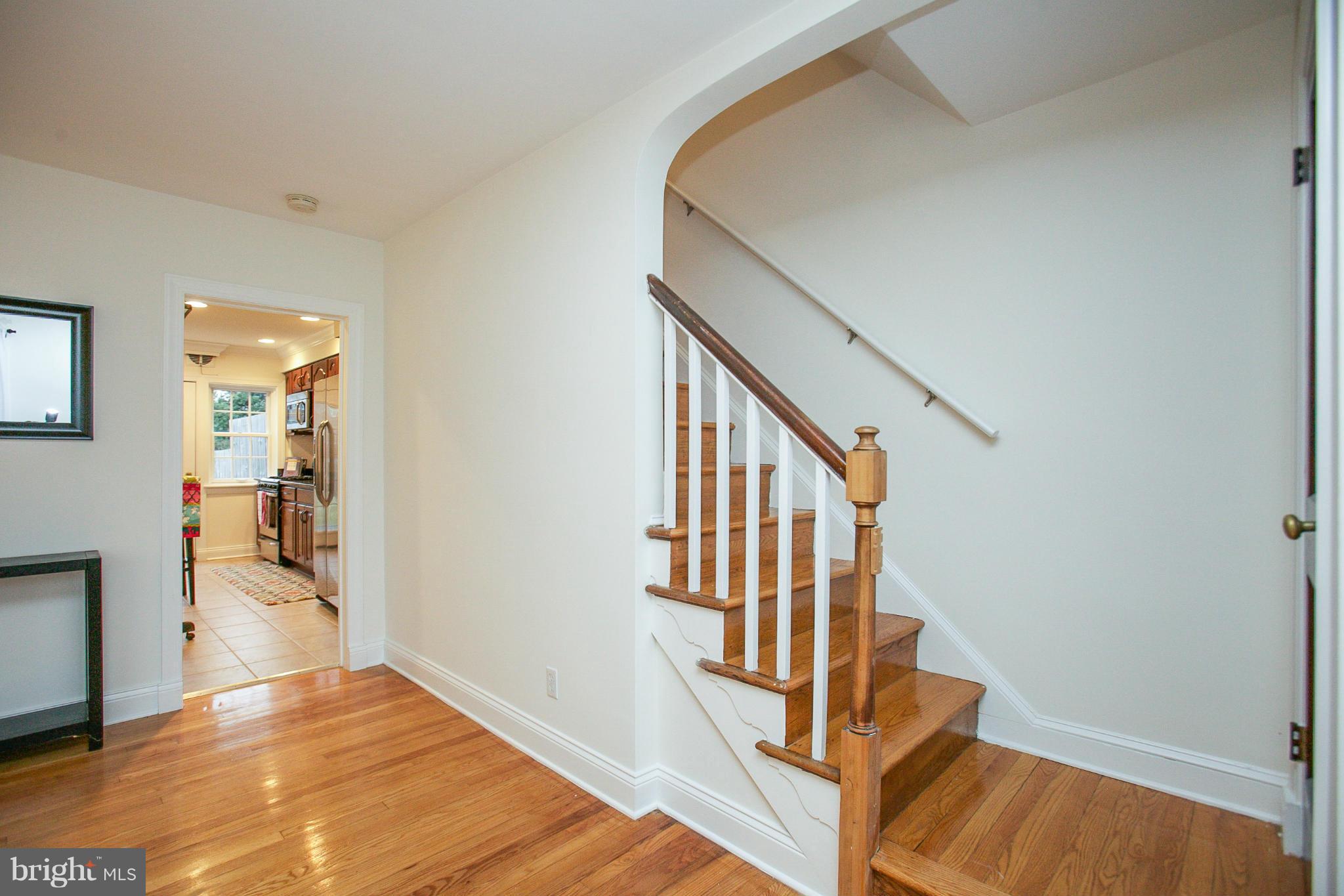 309 Overbrook Road Baltimore, MD 21212 - Photo 5 of 26 a view of a hallway with wooden floor and entryway