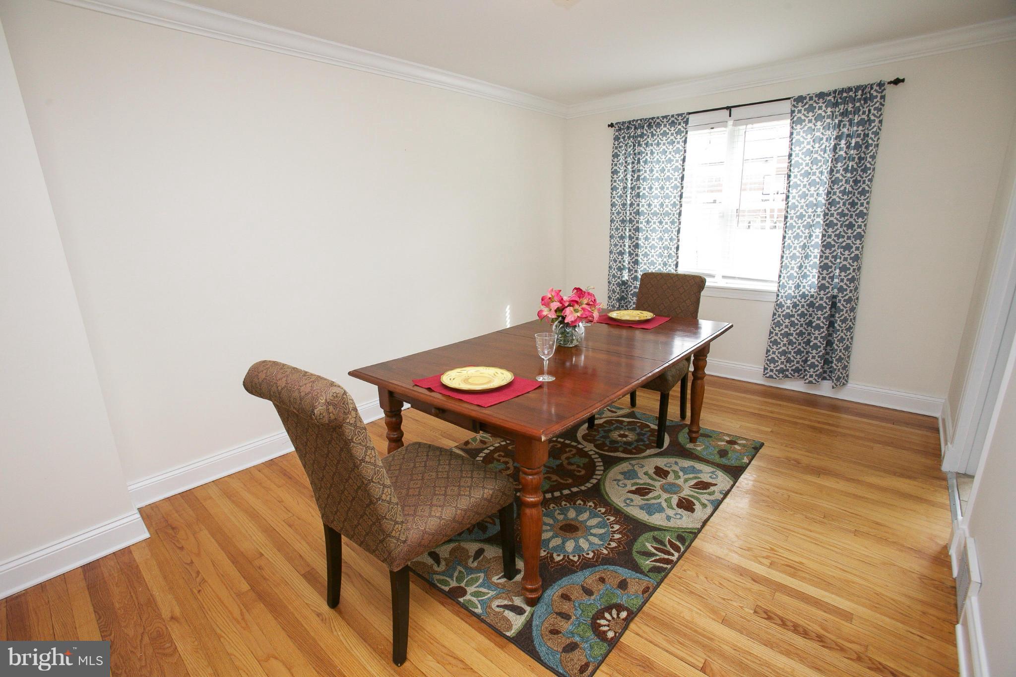 309 Overbrook Road Baltimore, MD 21212 - Photo 6 of 26 a view of a dining room with furniture and wooden floor