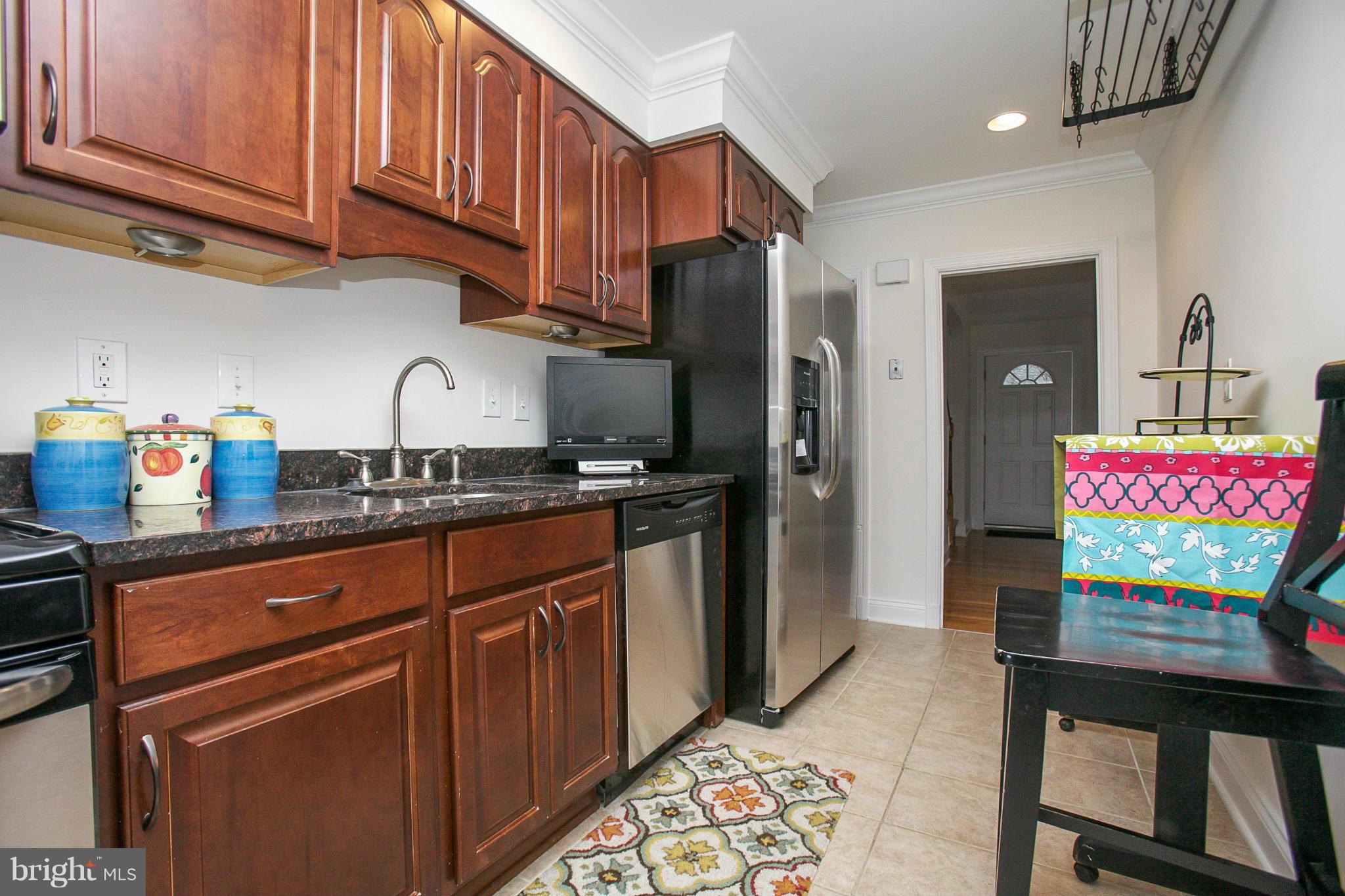 309 Overbrook Road Baltimore, MD 21212 - Photo 8 of 26 a kitchen with stainless steel appliances granite countertop a refrigerator and a stove top oven