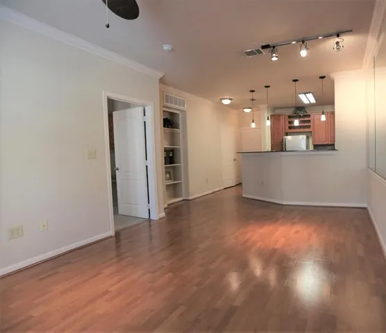 a view of a living room a room with wooden floor