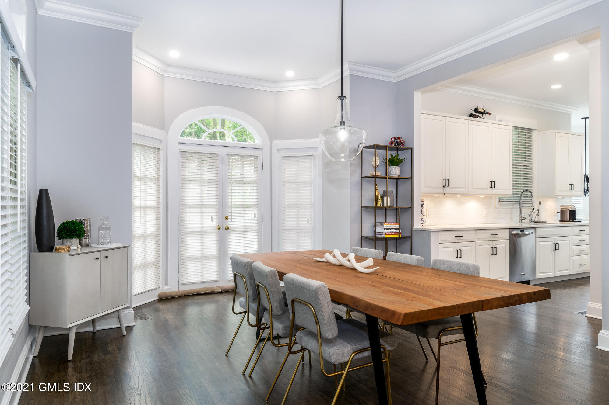 48 Spring Street, Unit 2 Greenwich, CT 06830 - Photo 12 of 36 a view of a dining room with furniture and wooden floor