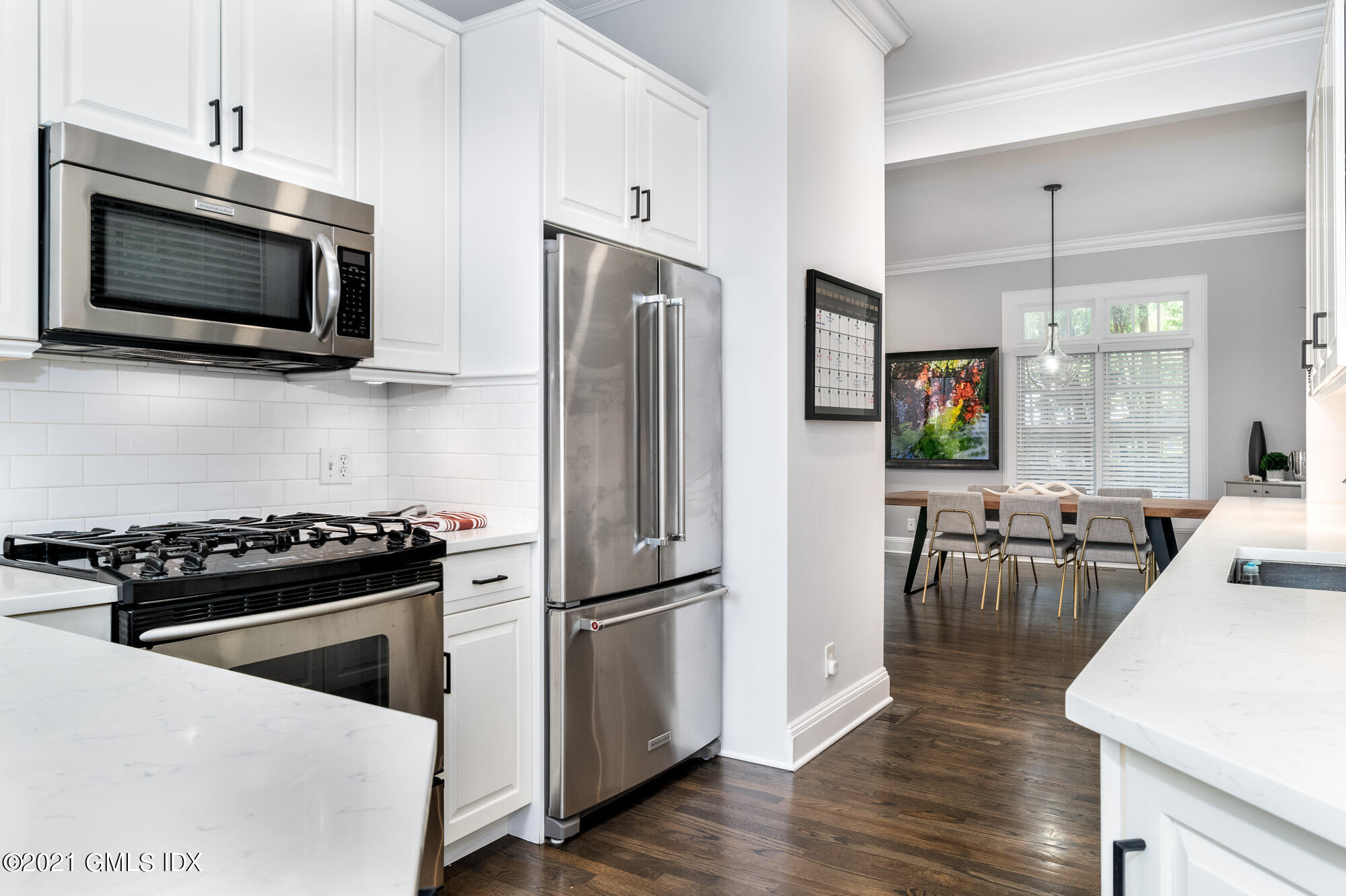 48 Spring Street, Unit 2 Greenwich, CT 06830 - Photo 14 of 36 a kitchen with a stove microwave and refrigerator