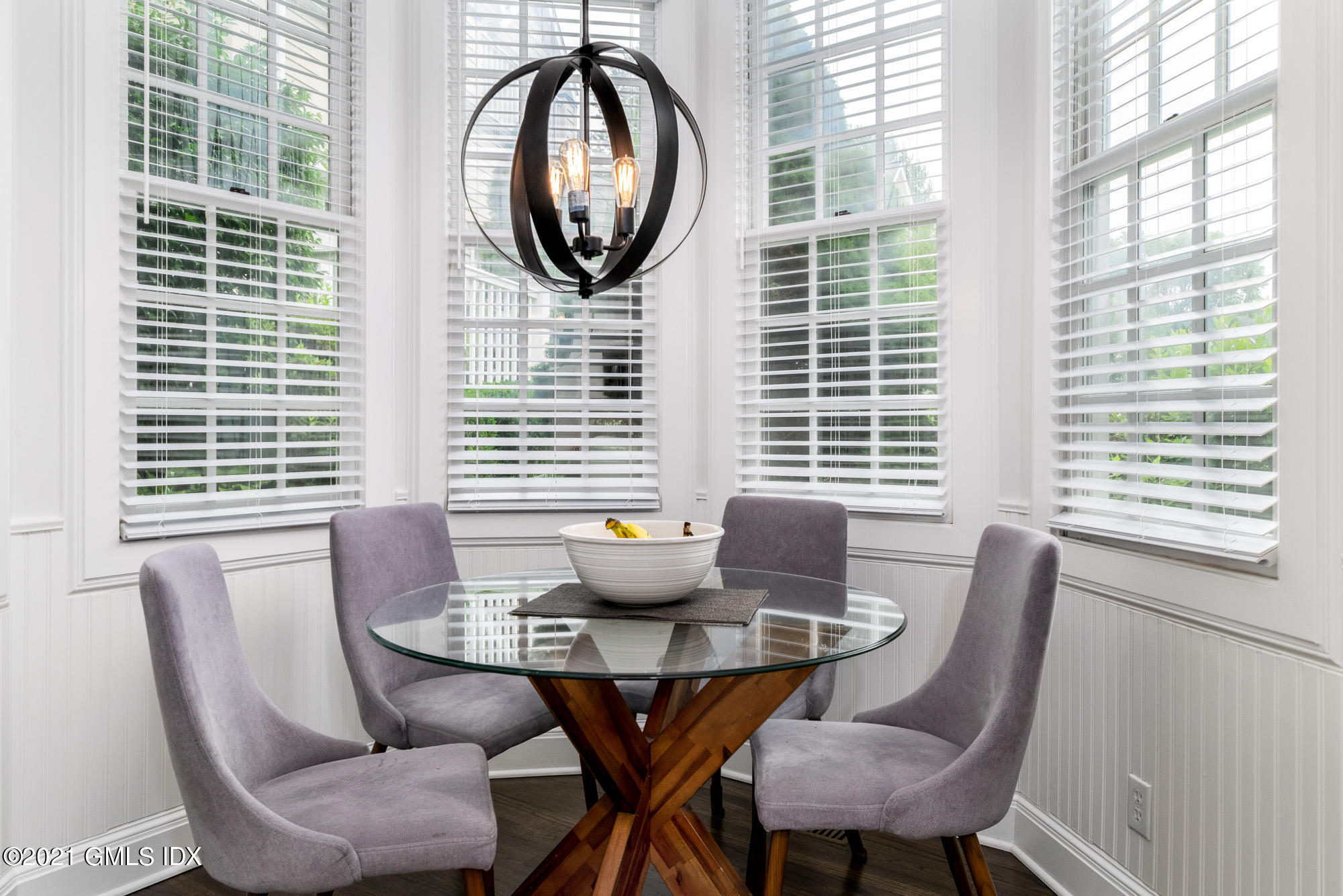 48 Spring Street, Unit 2 Greenwich, CT 06830 - Photo 16 of 36 a dining room with furniture and windows