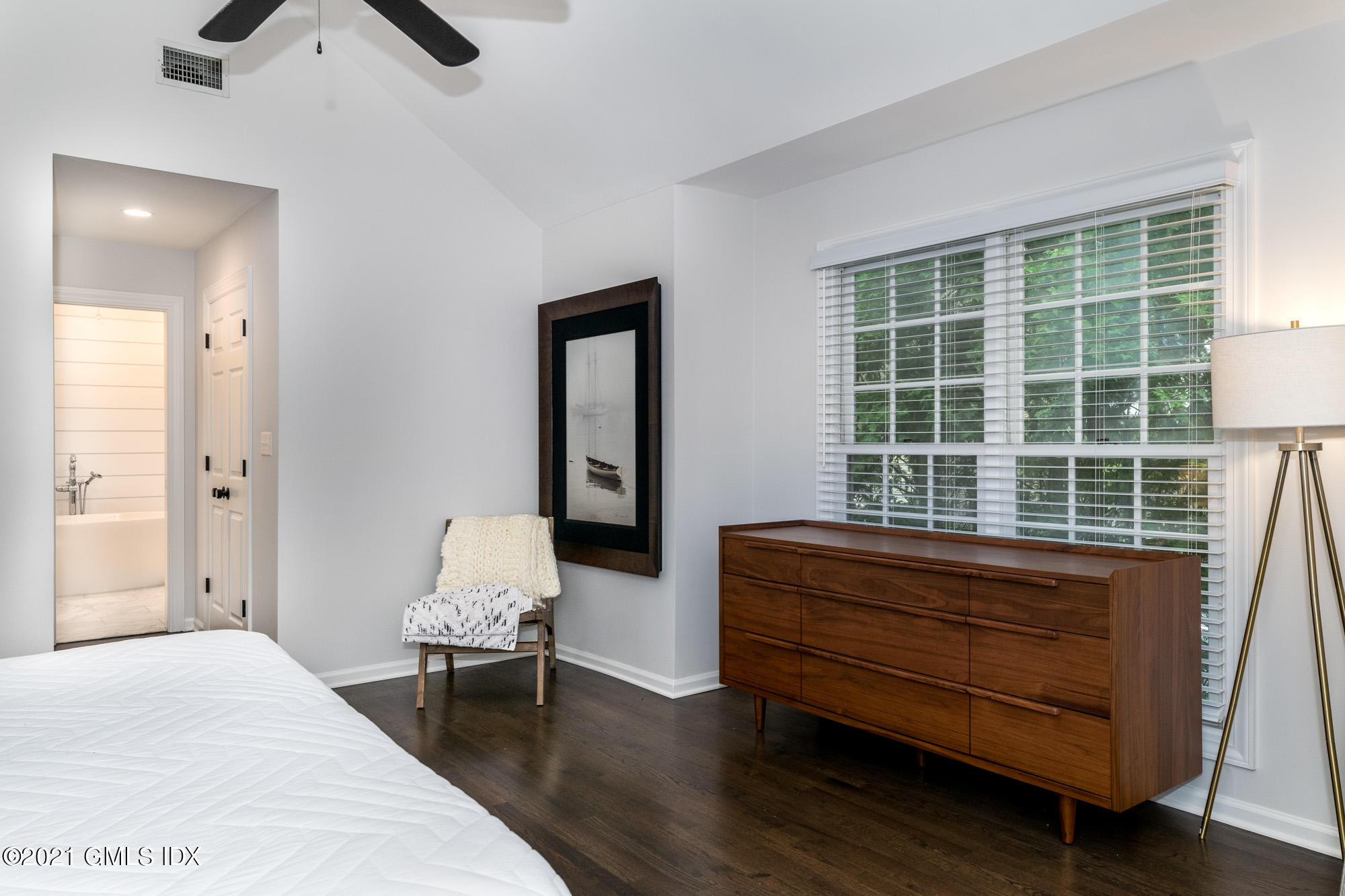 48 Spring Street, Unit 2 Greenwich, CT 06830 - Photo 20 of 36 a bedroom with a bed and a window