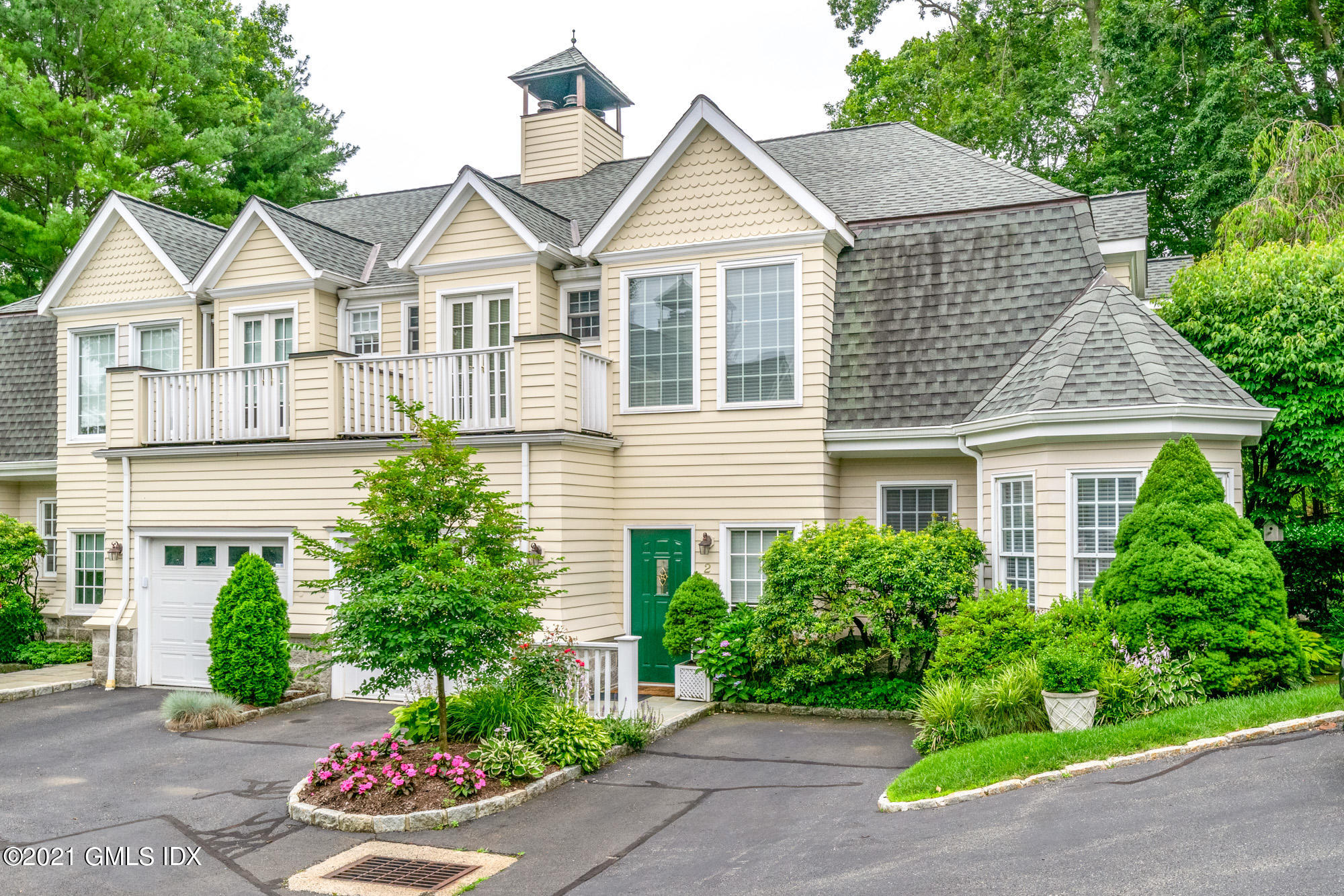 48 Spring Street, Unit 2 Greenwich, CT 06830 - Photo 2 of 36 a view of a yard in front of house