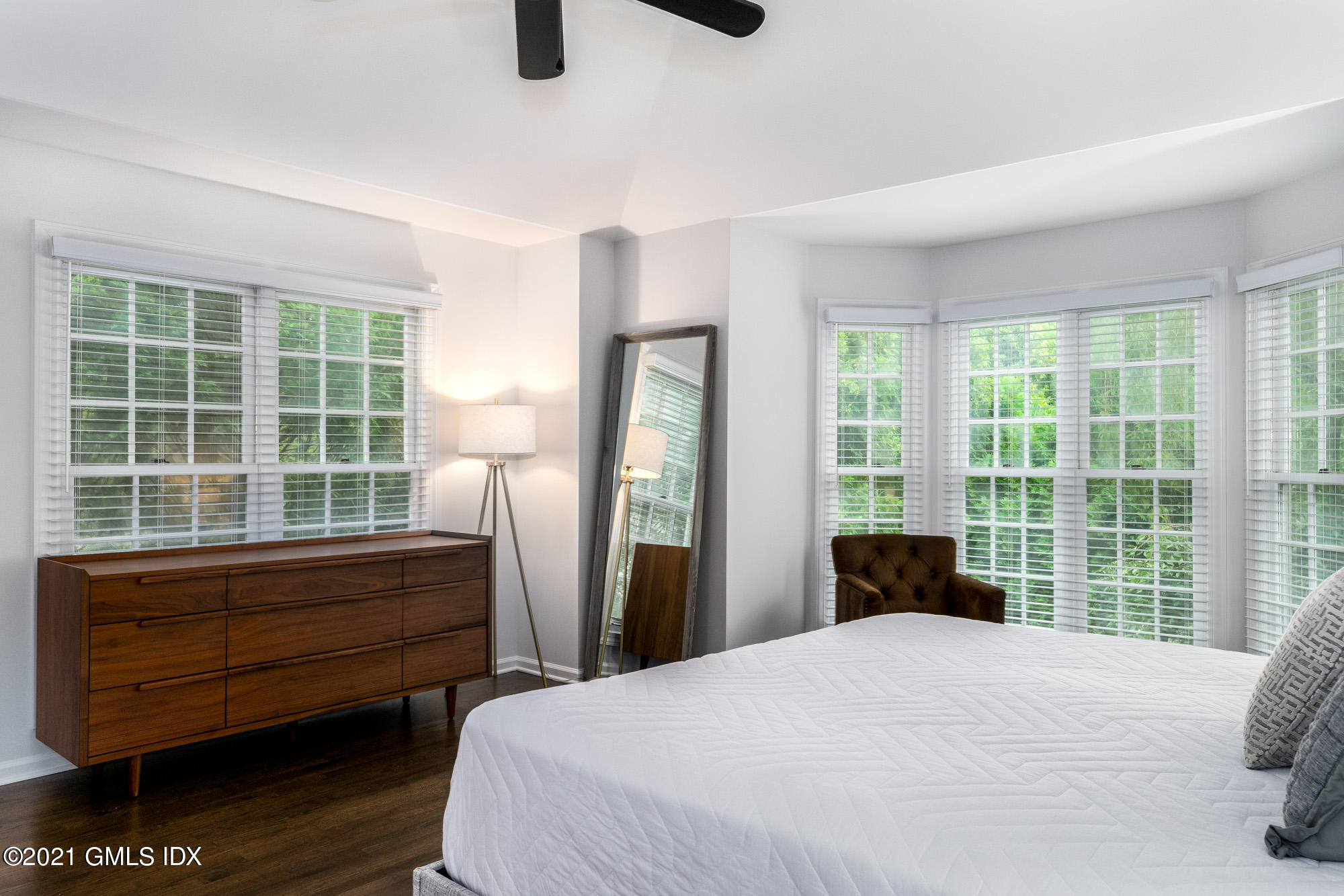 48 Spring Street, Unit 2 Greenwich, CT 06830 - Photo 21 of 36 a bedroom with a bed and a large window