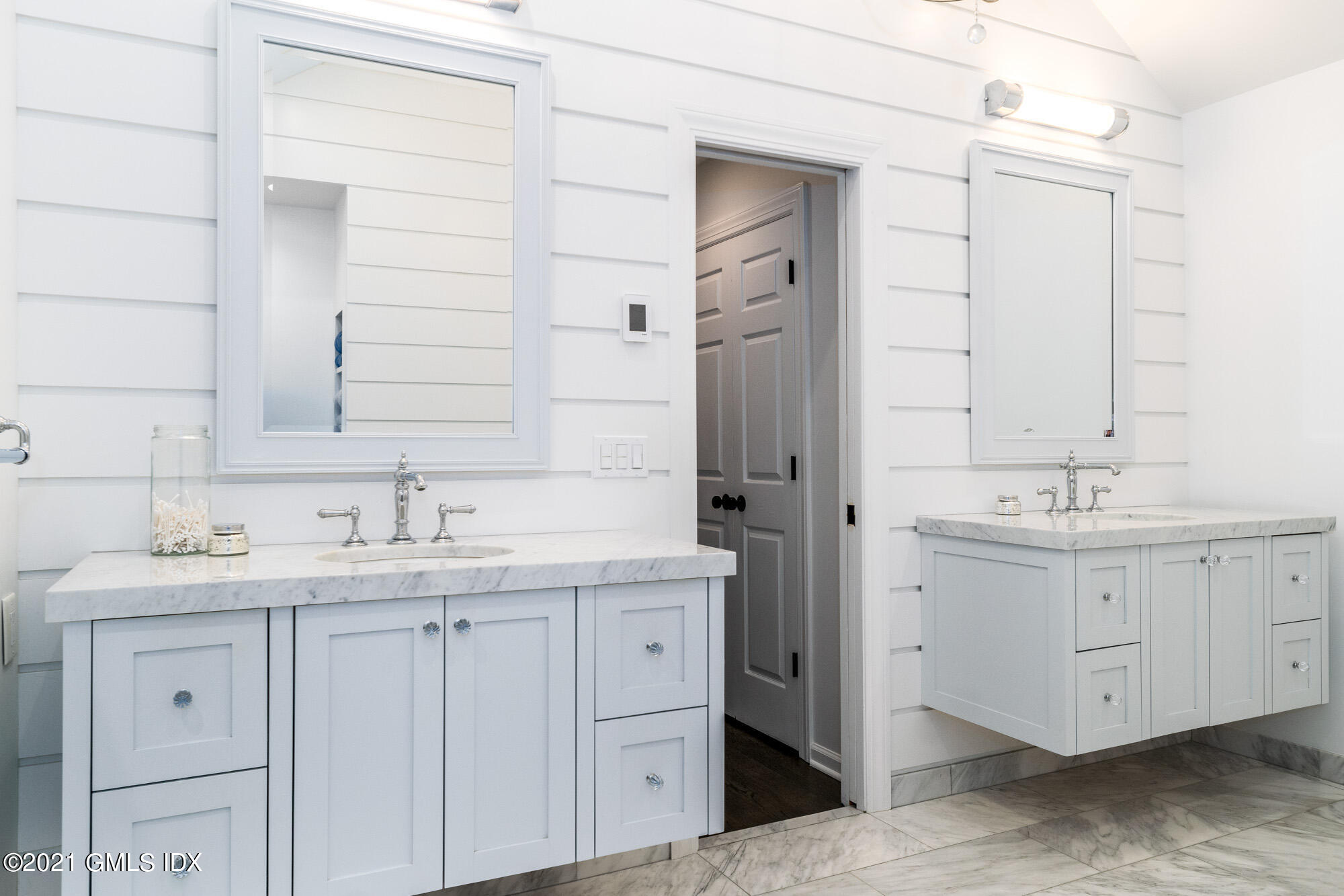 48 Spring Street, Unit 2 Greenwich, CT 06830 - Photo 23 of 36 a bathroom with a double vanity sink and mirror