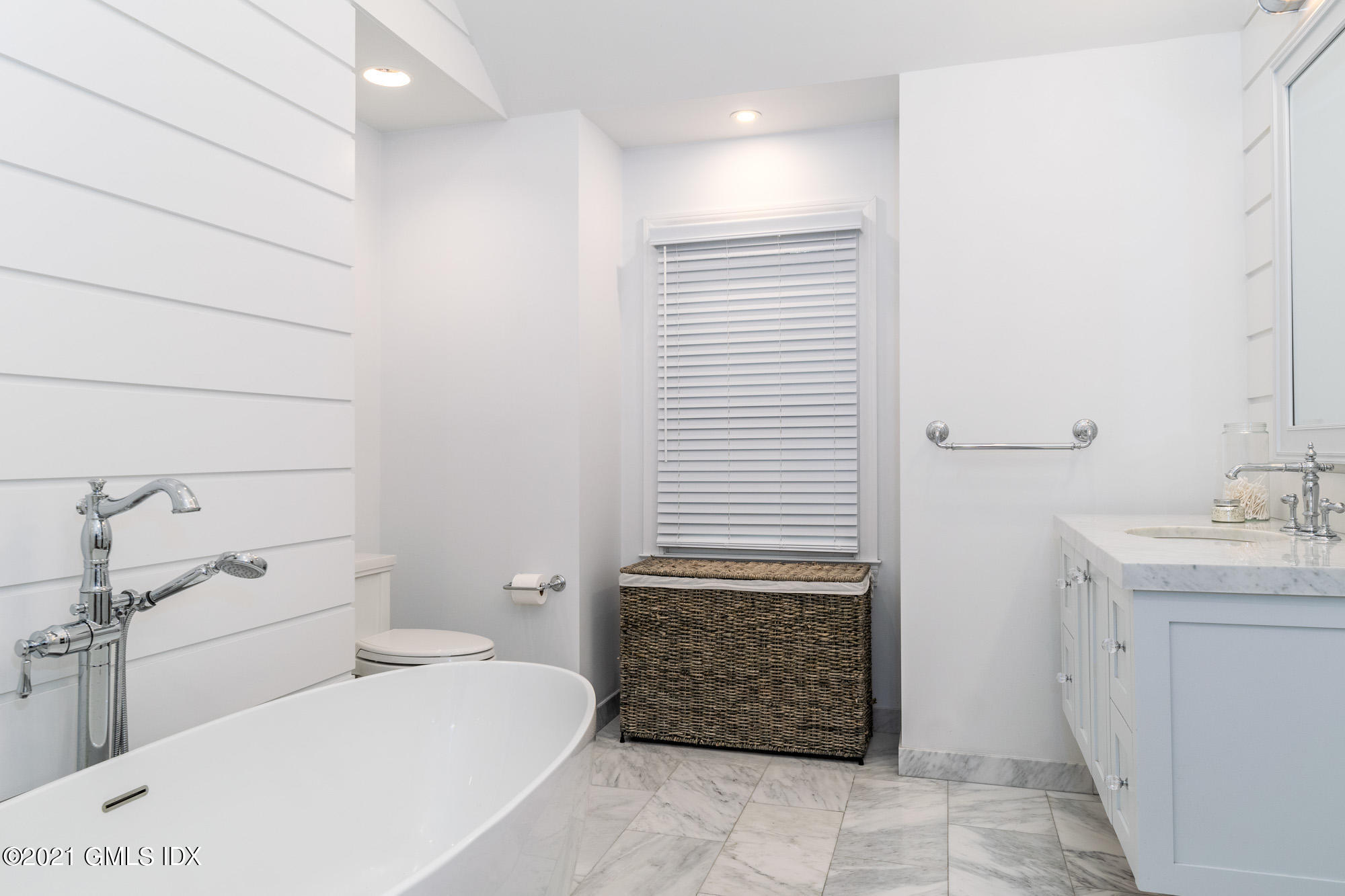 48 Spring Street, Unit 2 Greenwich, CT 06830 - Photo 24 of 36 a bathroom with a toilet a sink and mirror