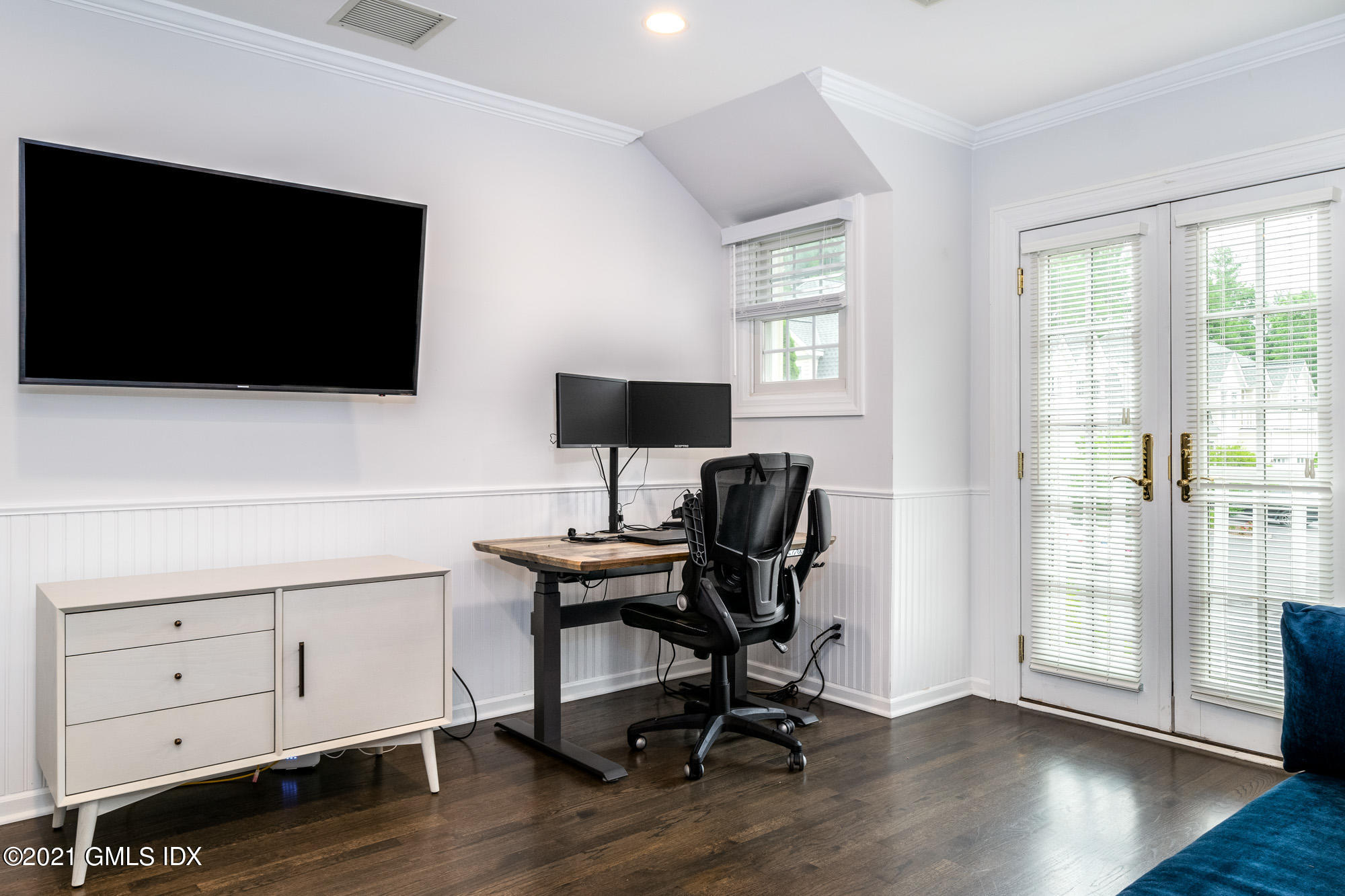 48 Spring Street, Unit 2 Greenwich, CT 06830 - Photo 30 of 36 a view of a workspace with wooden floor and white walls