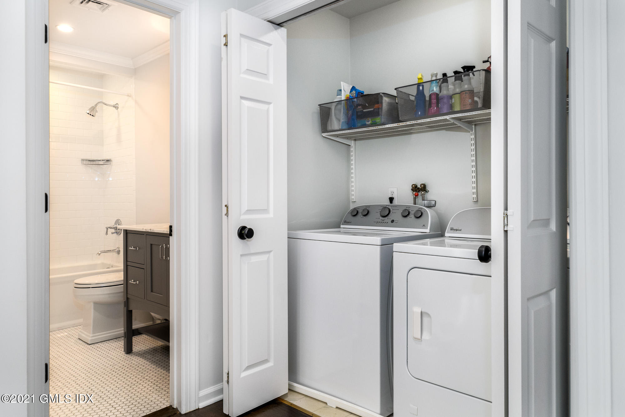 48 Spring Street, Unit 2 Greenwich, CT 06830 - Photo 32 of 36 a kitchen with a refrigerator and cabinets