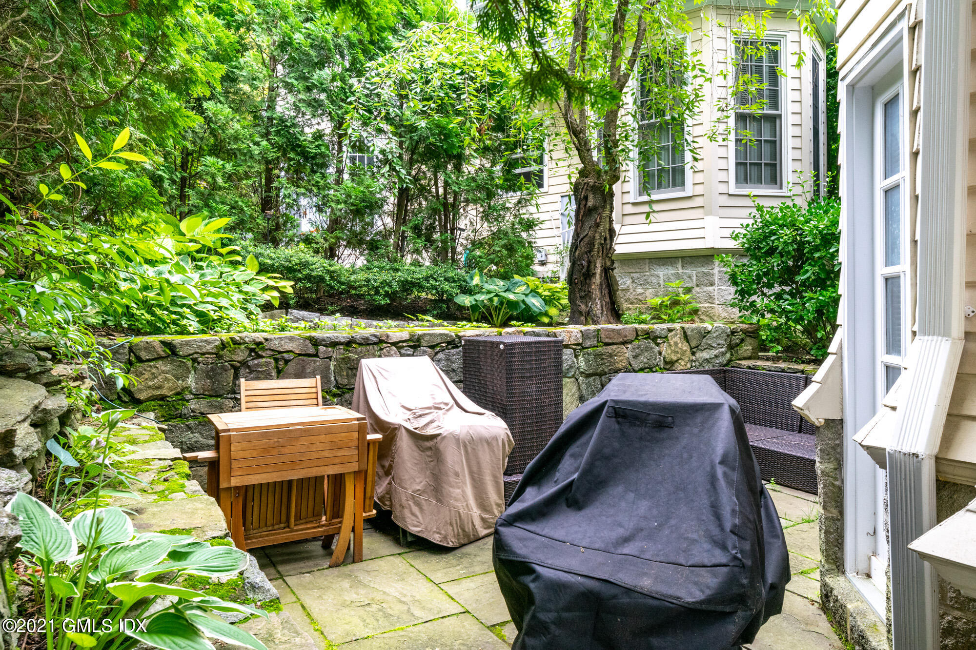 48 Spring Street, Unit 2 Greenwich, CT 06830 - Photo 34 of 36 a view of balcony with two chairs and a potted plant