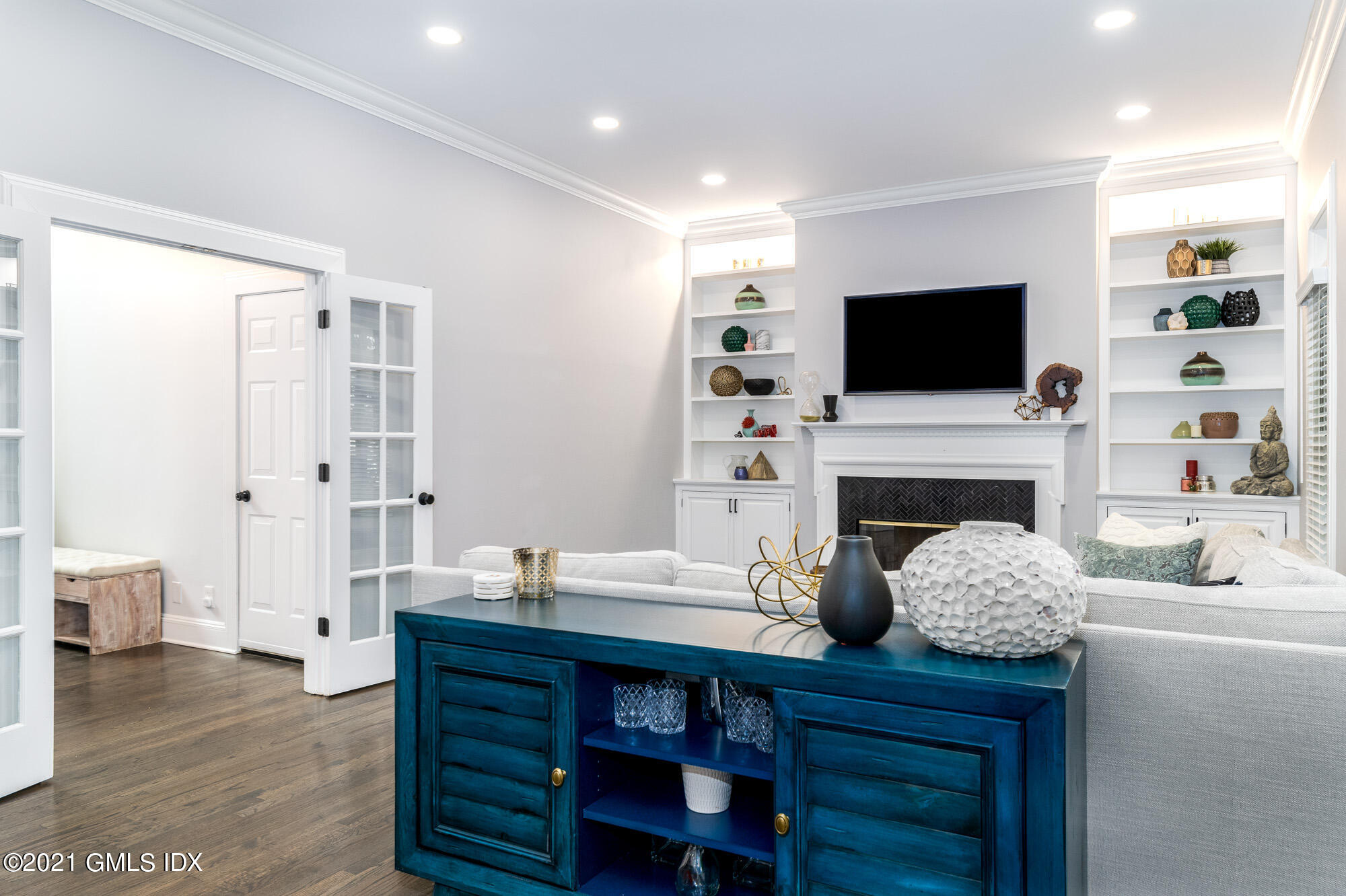 48 Spring Street, Unit 2 Greenwich, CT 06830 - Photo 6 of 36 a living room with furniture a flat screen tv and a fireplace