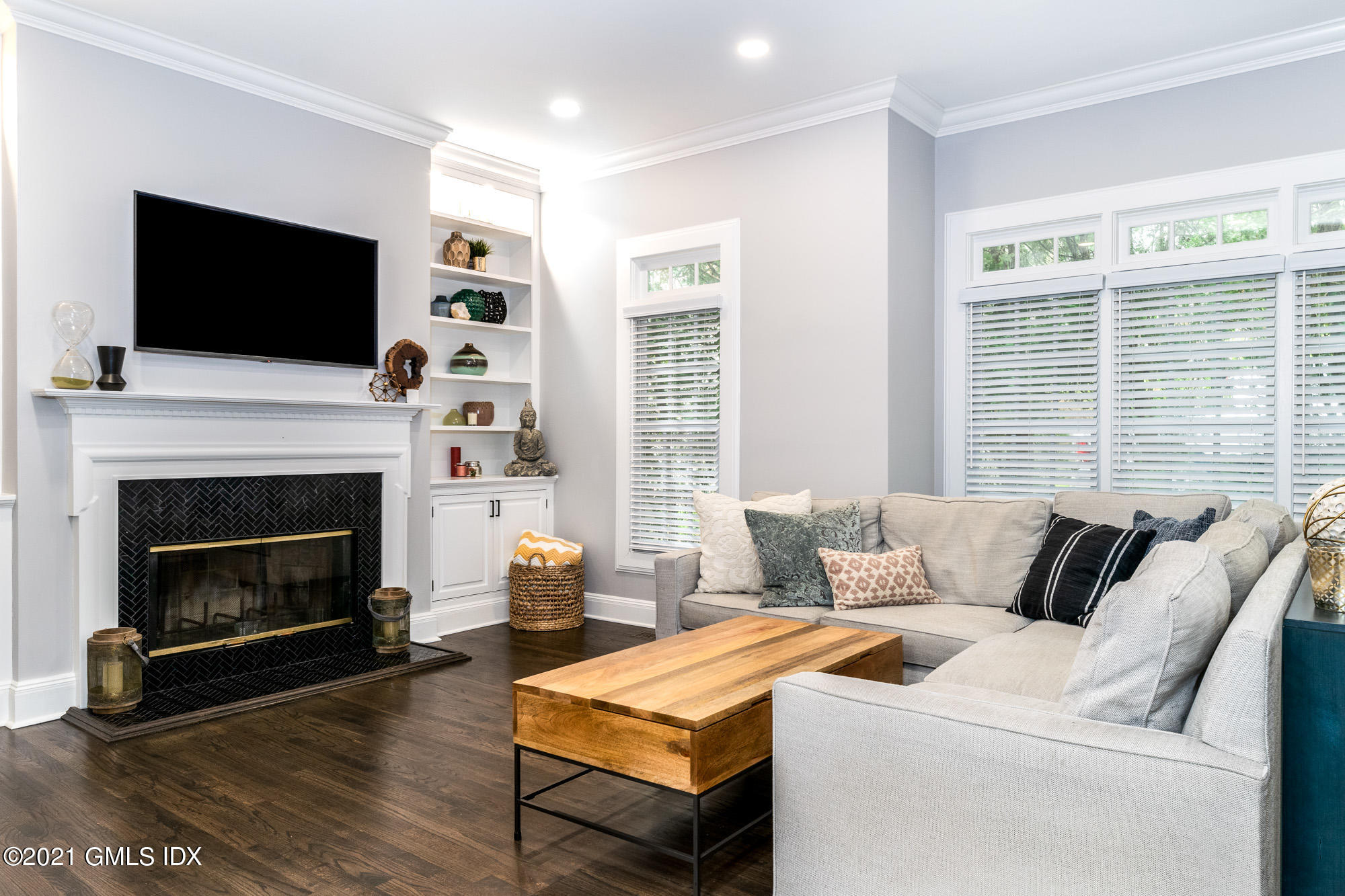 48 Spring Street, Unit 2 Greenwich, CT 06830 - Photo 7 of 36 a living room with furniture fireplace and flat screen tv