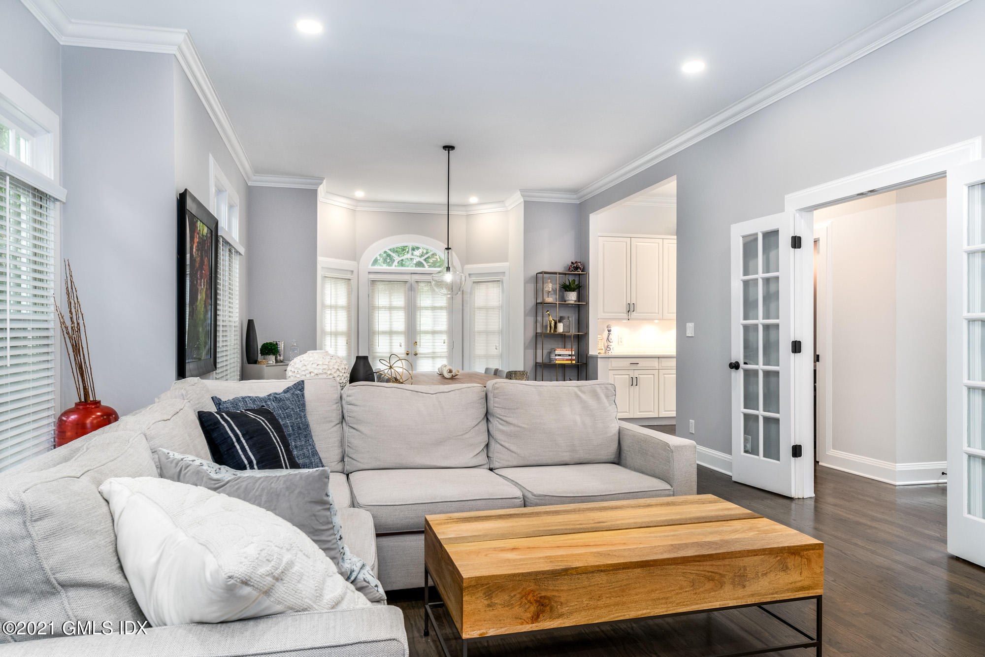 48 Spring Street, Unit 2 Greenwich, CT 06830 - Photo 8 of 36 a living room with furniture and a large window